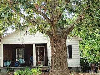 1504 Lane Street Raleigh, NC 27610 - Photo 1 of 1 a front view of a house with garden