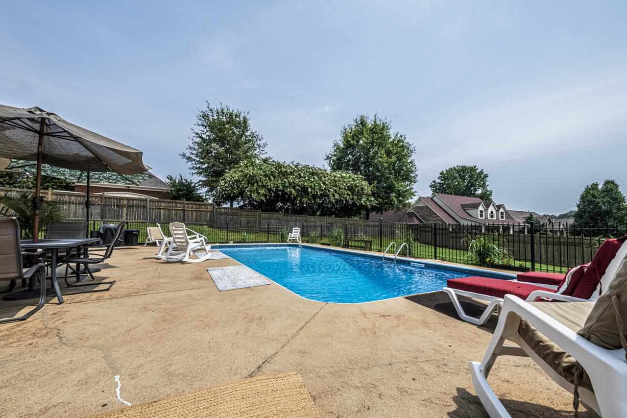 193 Walker Lake Road Atoka, TN 38004 - Photo 17 of 25 Iron fence separates the pool area from the rest of the lawn, perfect play area for the children and/or pets.