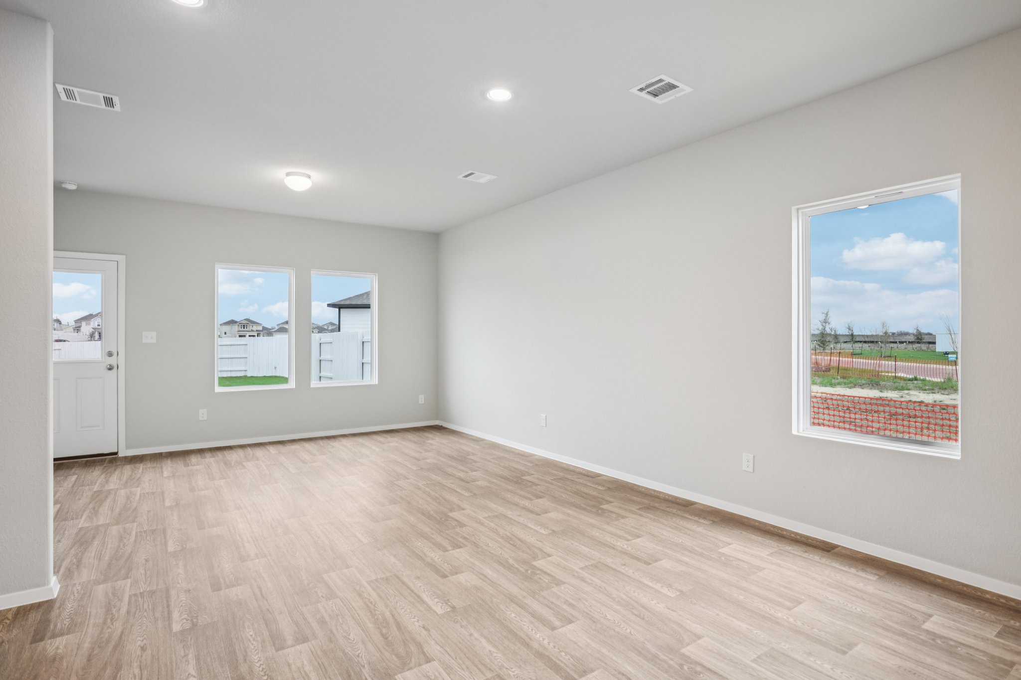104 Summer Drive Elgin, TX 78621 - Photo 14 of 40 wooden floor in an empty room with a window