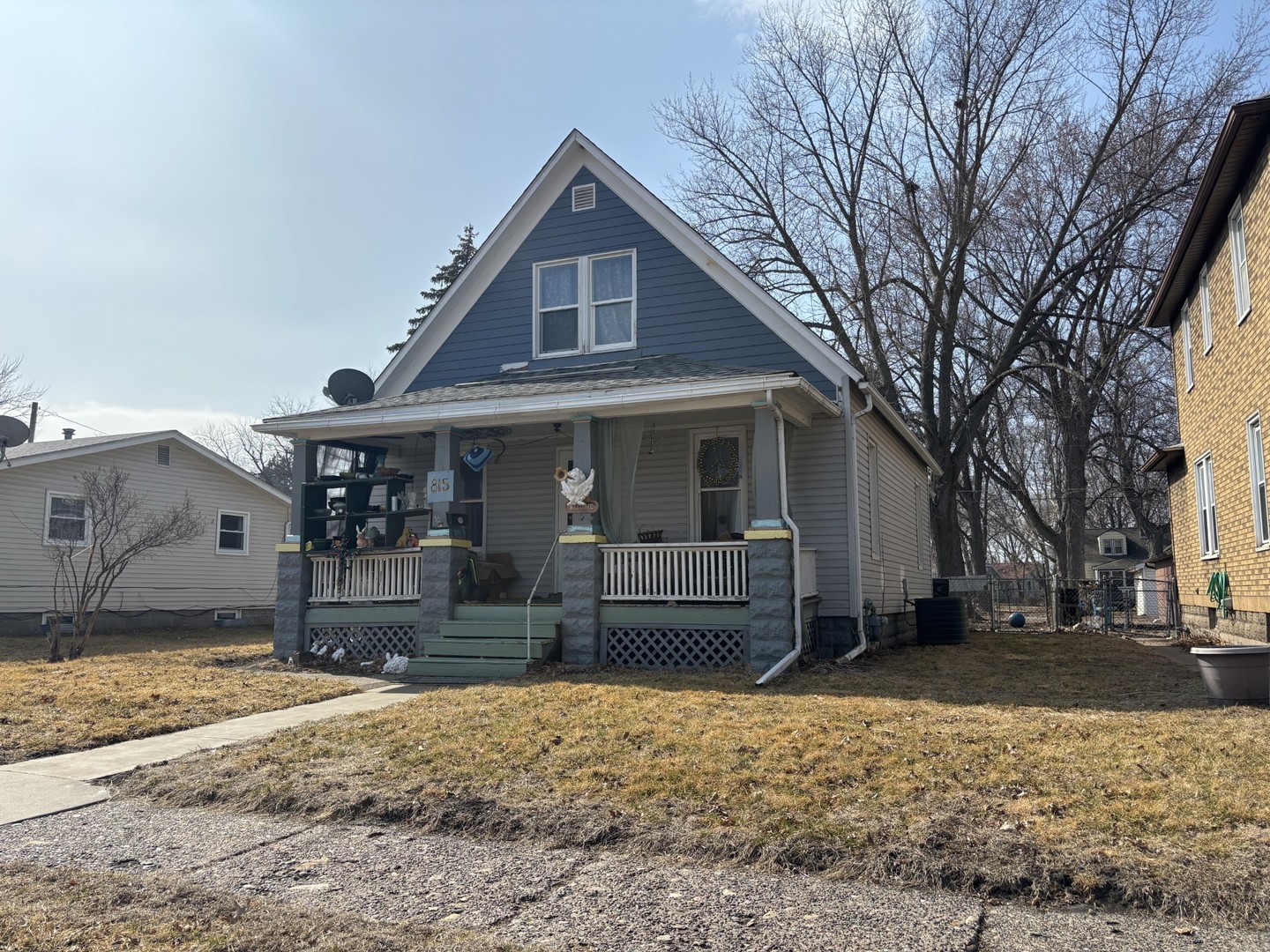 815 20th Street East Moline, IL 61244 - Photo 2 of 12 a front view of a house with a yard and large tree