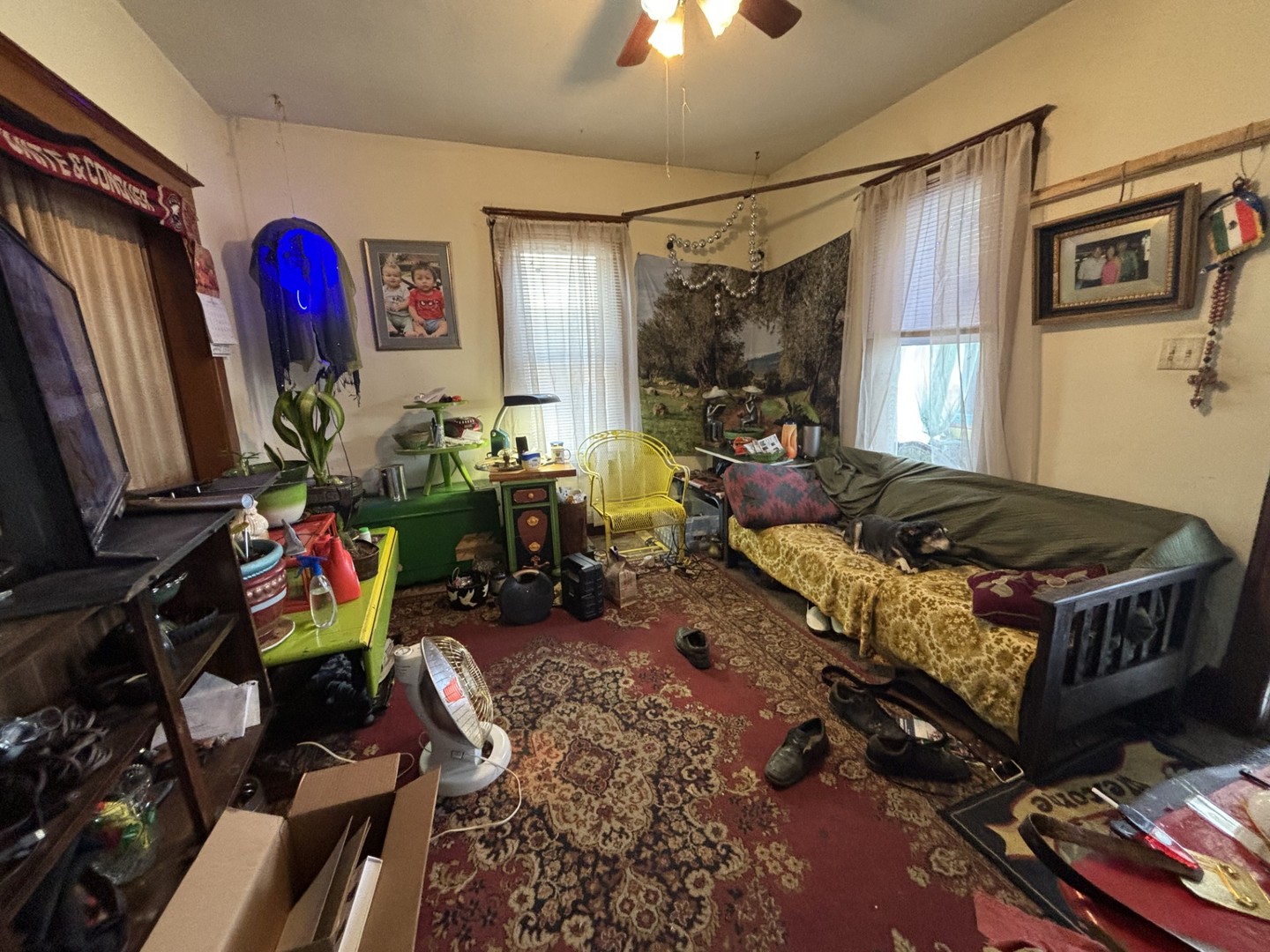 815 20th Street East Moline, IL 61244 - Photo 4 of 12 a living room with lots of furniture and a flat screen tv