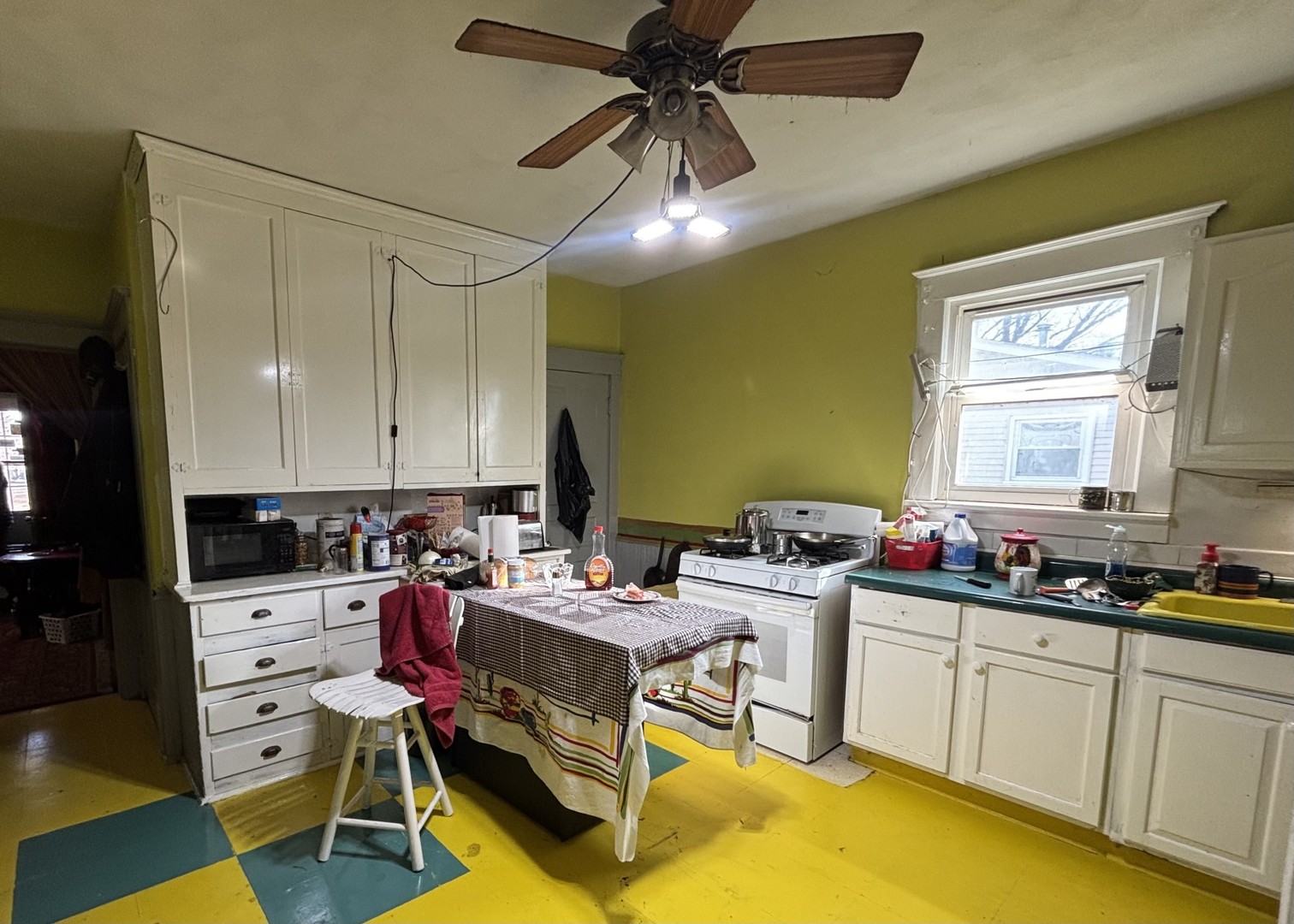 815 20th Street East Moline, IL 61244 - Photo 5 of 12 a kitchen with a sink and cabinets