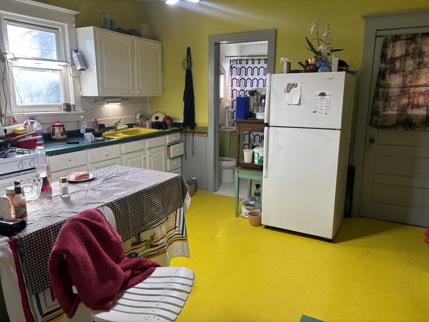 815 20th Street East Moline, IL 61244 - Photo 6 of 12 a kitchen with a refrigerator and a stove top oven