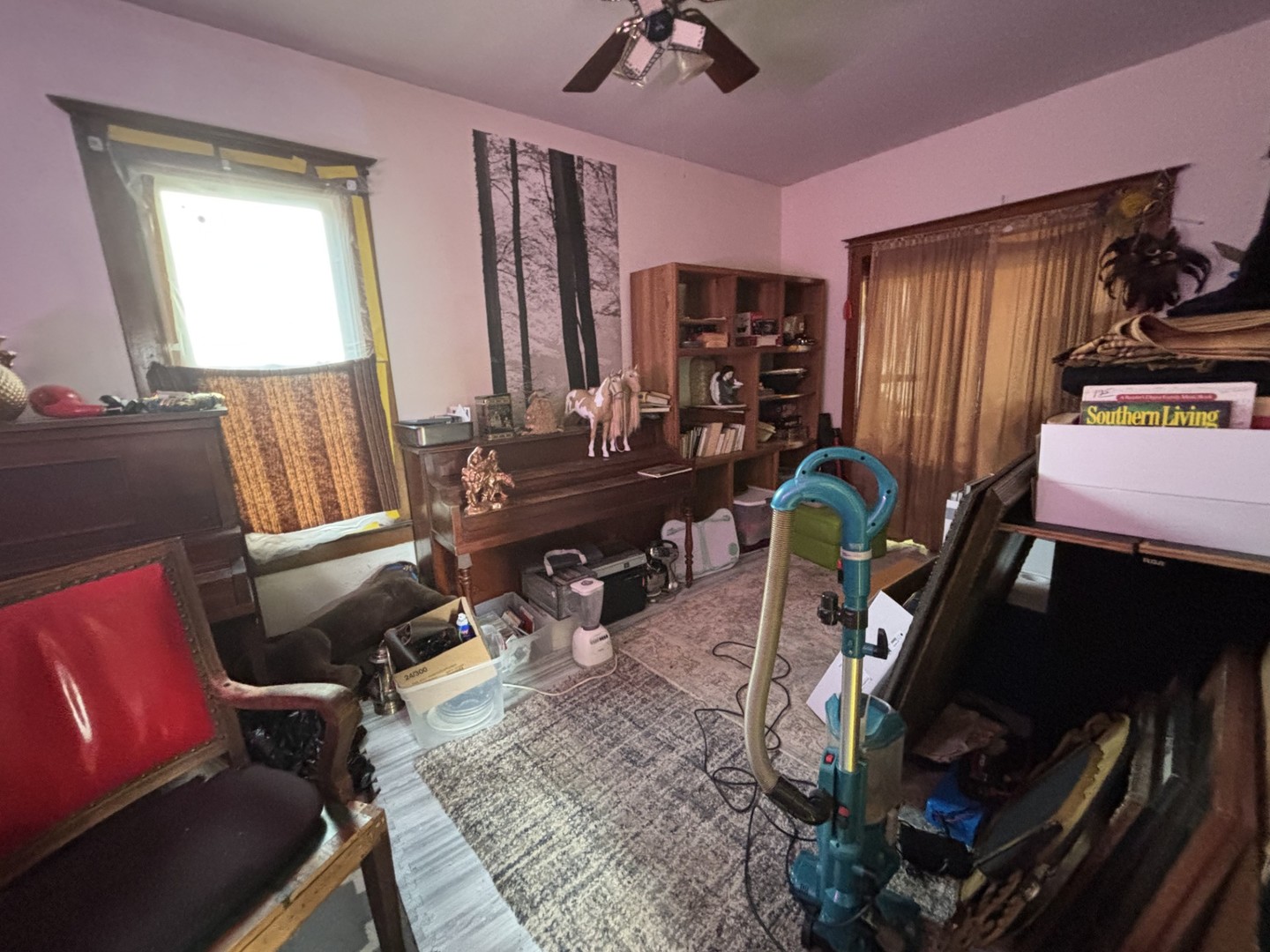 815 20th Street East Moline, IL 61244 - Photo 7 of 12 a living room with furniture and a window