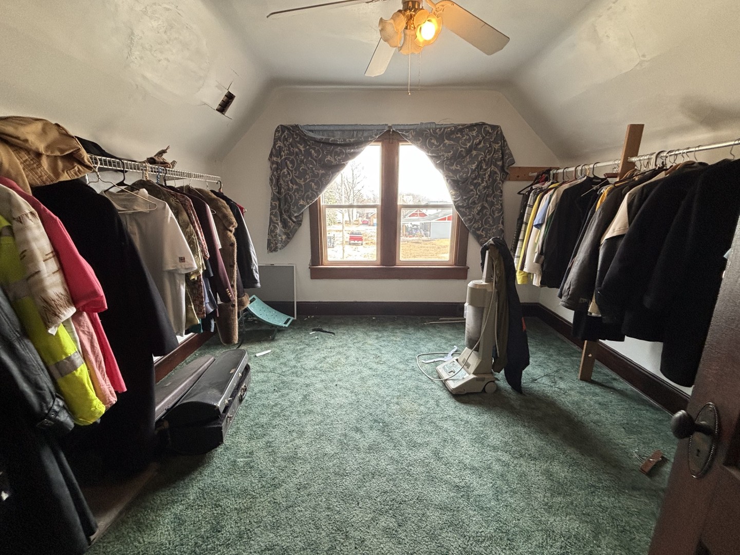 815 20th Street East Moline, IL 61244 - Photo 9 of 12 a view of walk in closet with clothes and shoes
