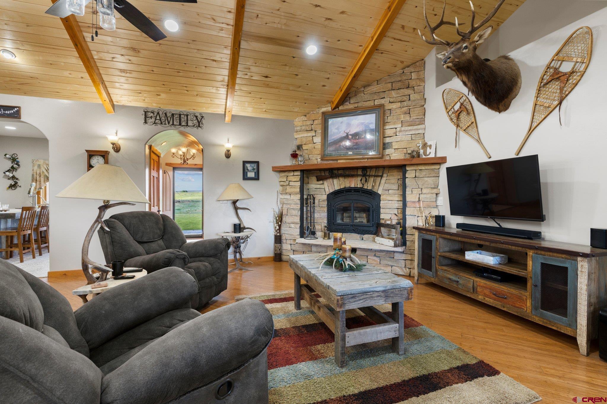 16132 Ee Road Pleasant View, CO 81331 - Photo 11 of 35 a living room with furniture and a flat screen tv