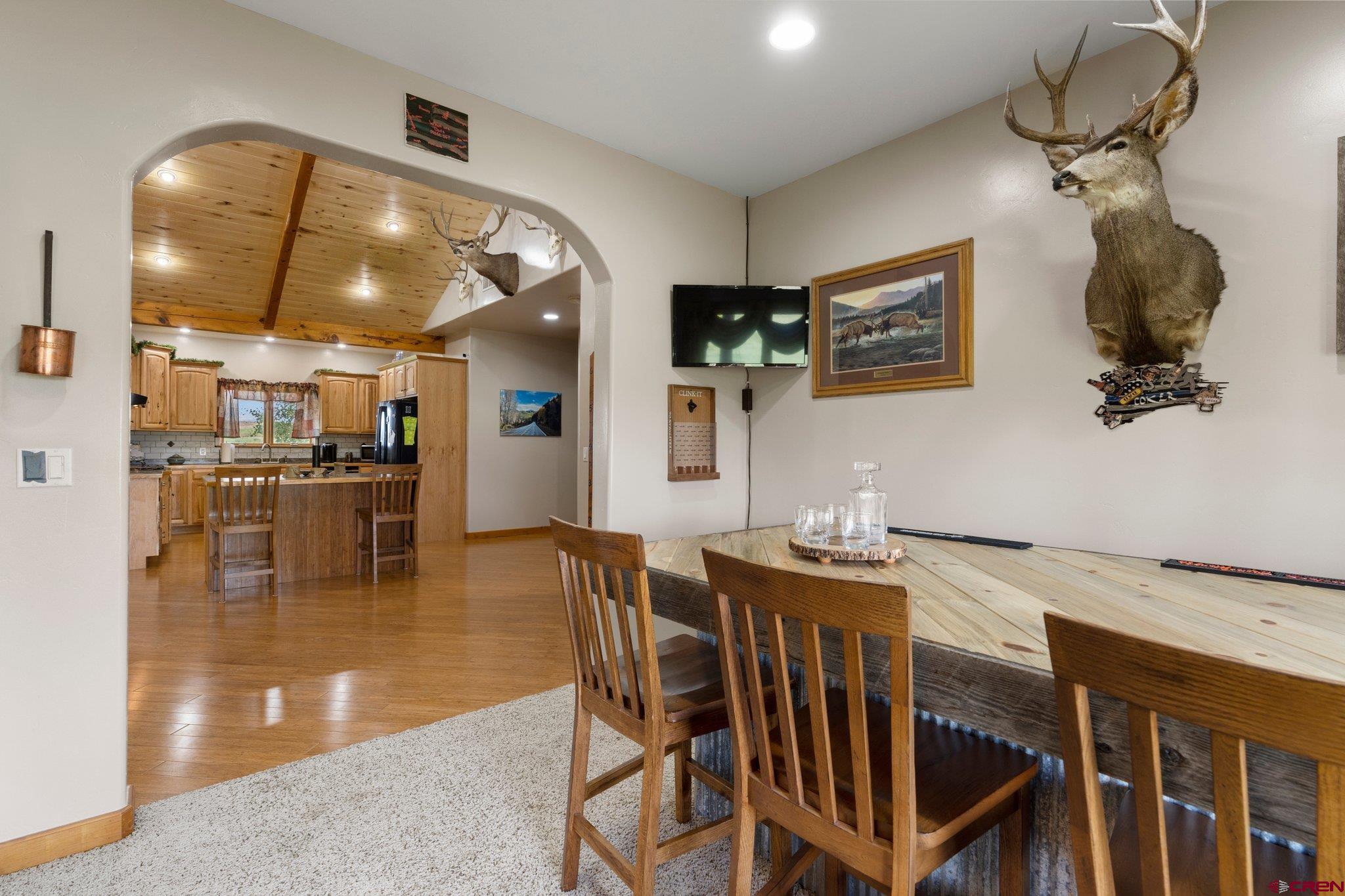 16132 Ee Road Pleasant View, CO 81331 - Photo 15 of 35 a kitchen with a table and chairs in it
