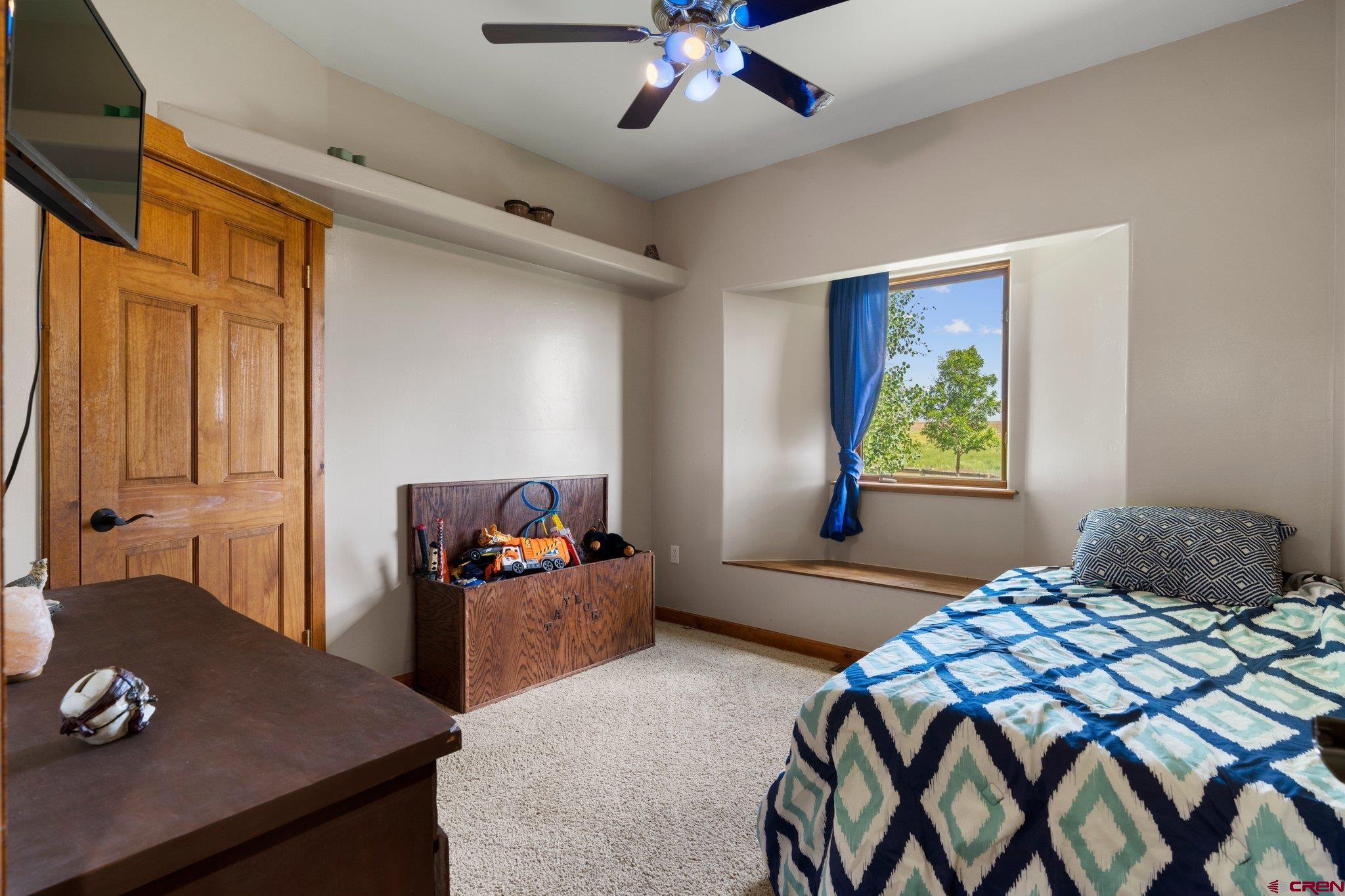 16132 Ee Road Pleasant View, CO 81331 - Photo 18 of 35 a bedroom with a bed and a desk