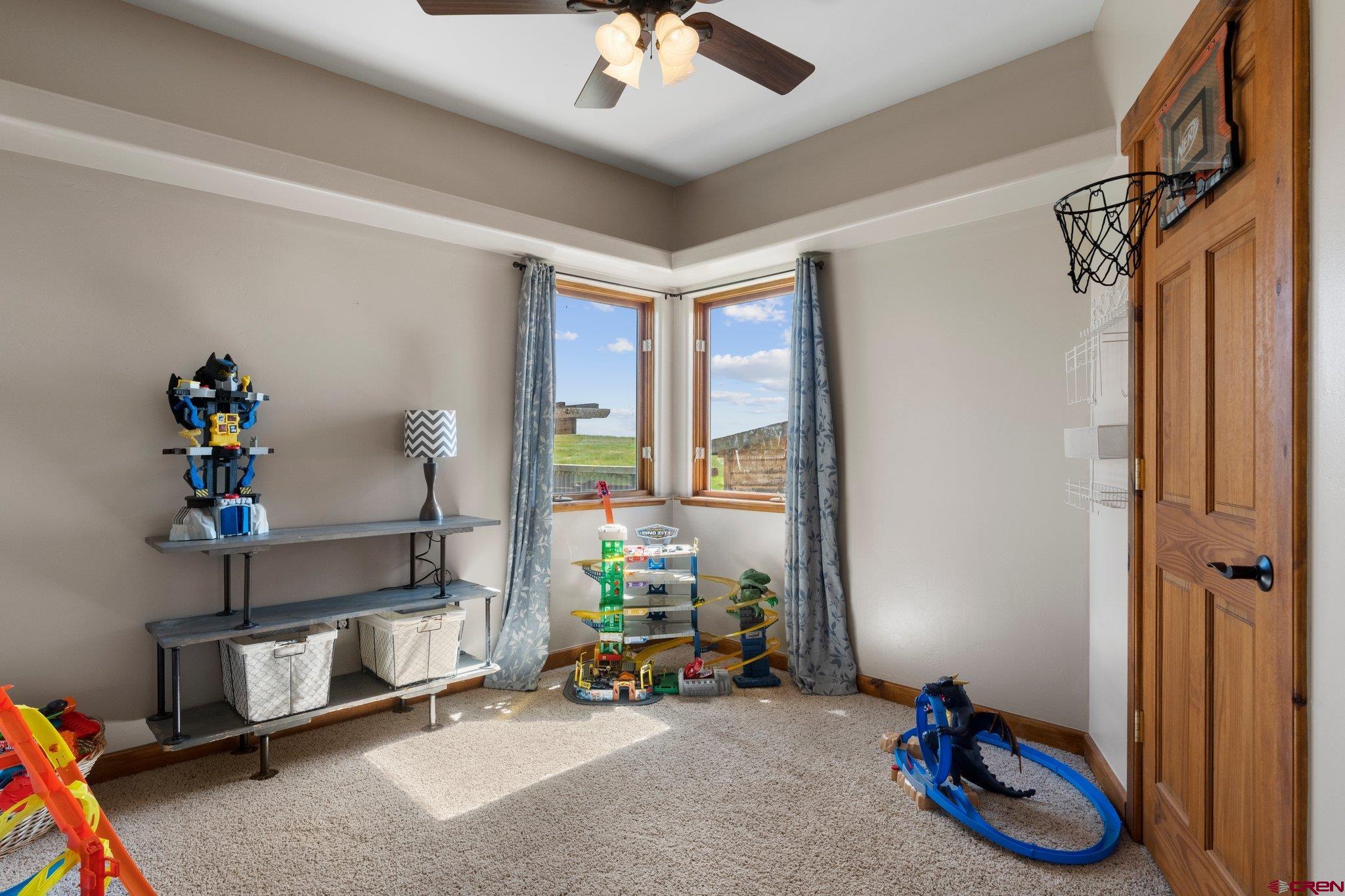 16132 Ee Road Pleasant View, CO 81331 - Photo 23 of 35 a bedroom with furniture and a window