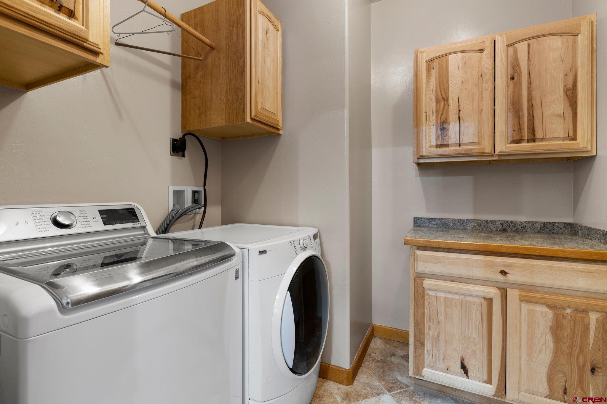 16132 Ee Road Pleasant View, CO 81331 - Photo 26 of 35 a utility room with dryer and washer