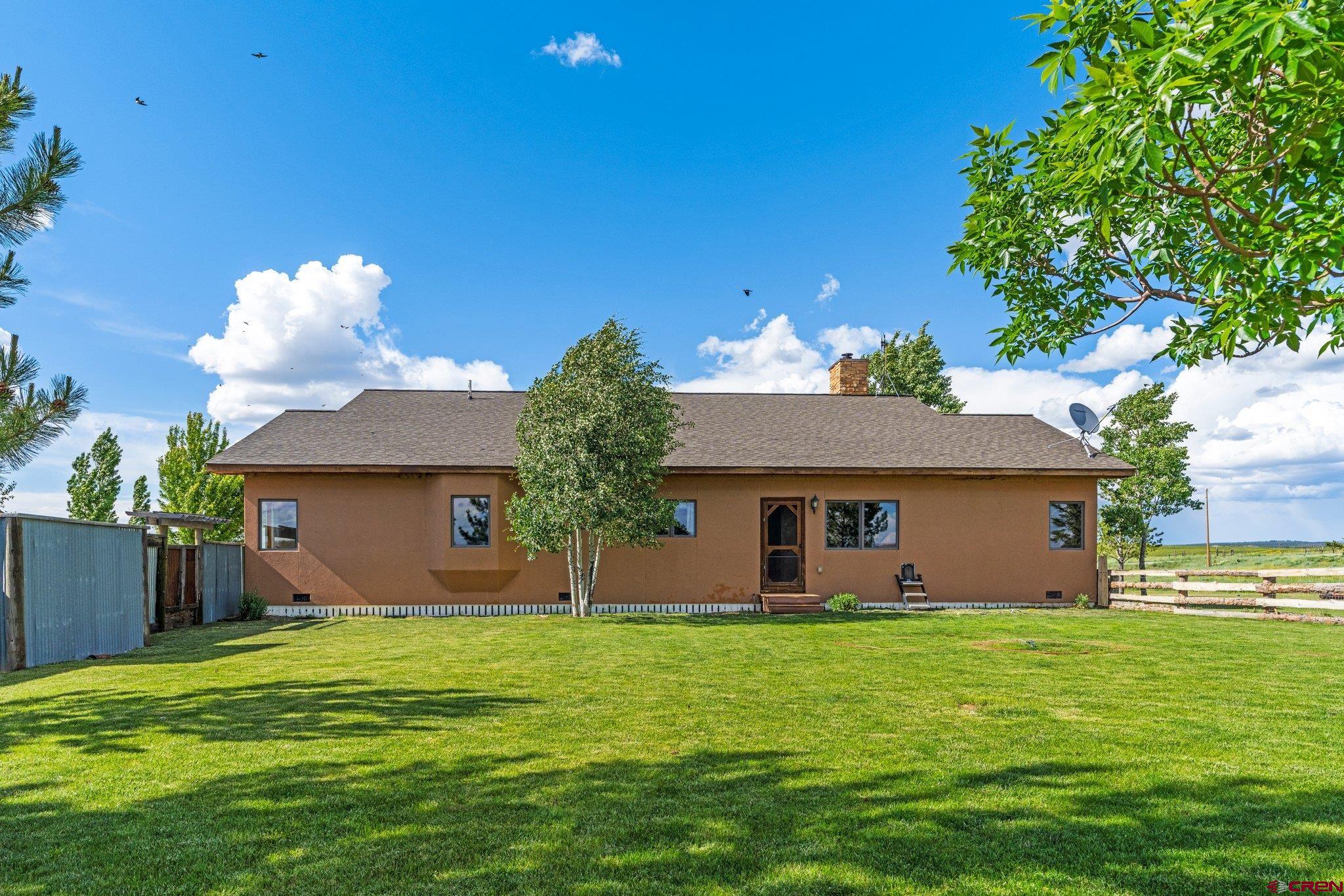 16132 Ee Road Pleasant View, CO 81331 - Photo 32 of 35 a front view of house with a garden
