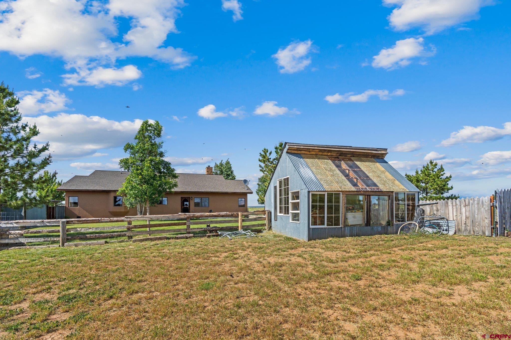 16132 Ee Road Pleasant View, CO 81331 - Photo 33 of 35 a view of a house with a backyard