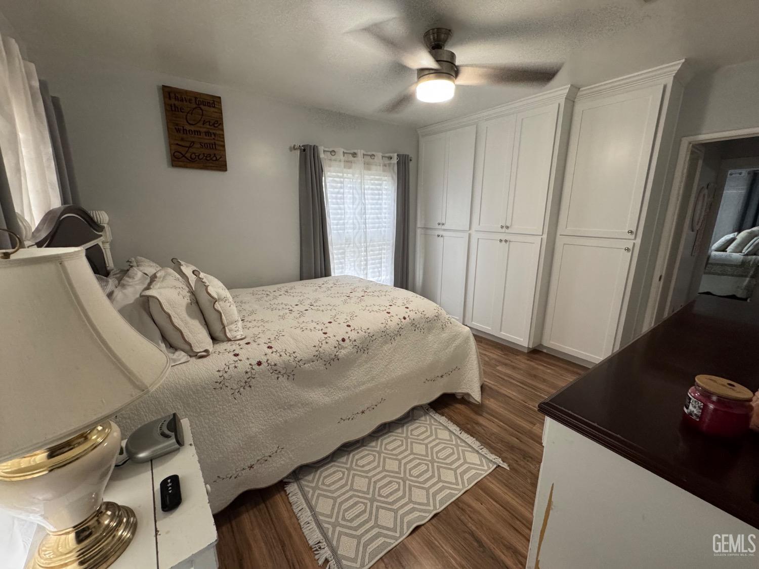 Undisclosed Address Bakersfield, CA 93304 - Photo 11 of 19 a bedroom with a bed and a flat tv screen on the dresser