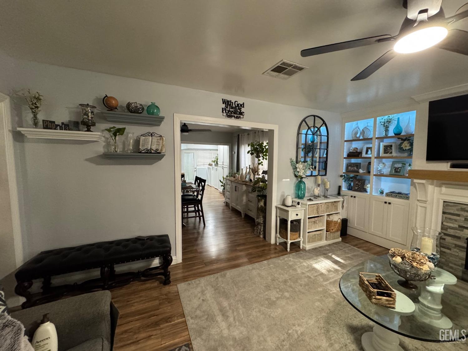 Undisclosed Address Bakersfield, CA 93304 - Photo 4 of 19 a living room with furniture and a flat screen tv