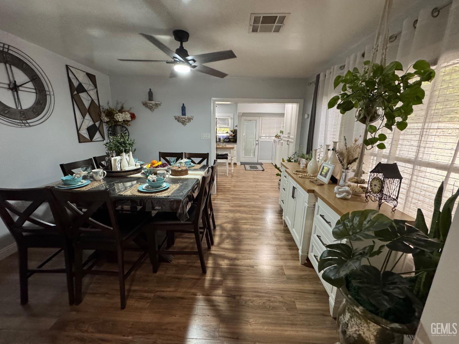 Undisclosed Address Bakersfield, CA 93304 - Photo 5 of 19 a view of a dining room with furniture and wooden floor