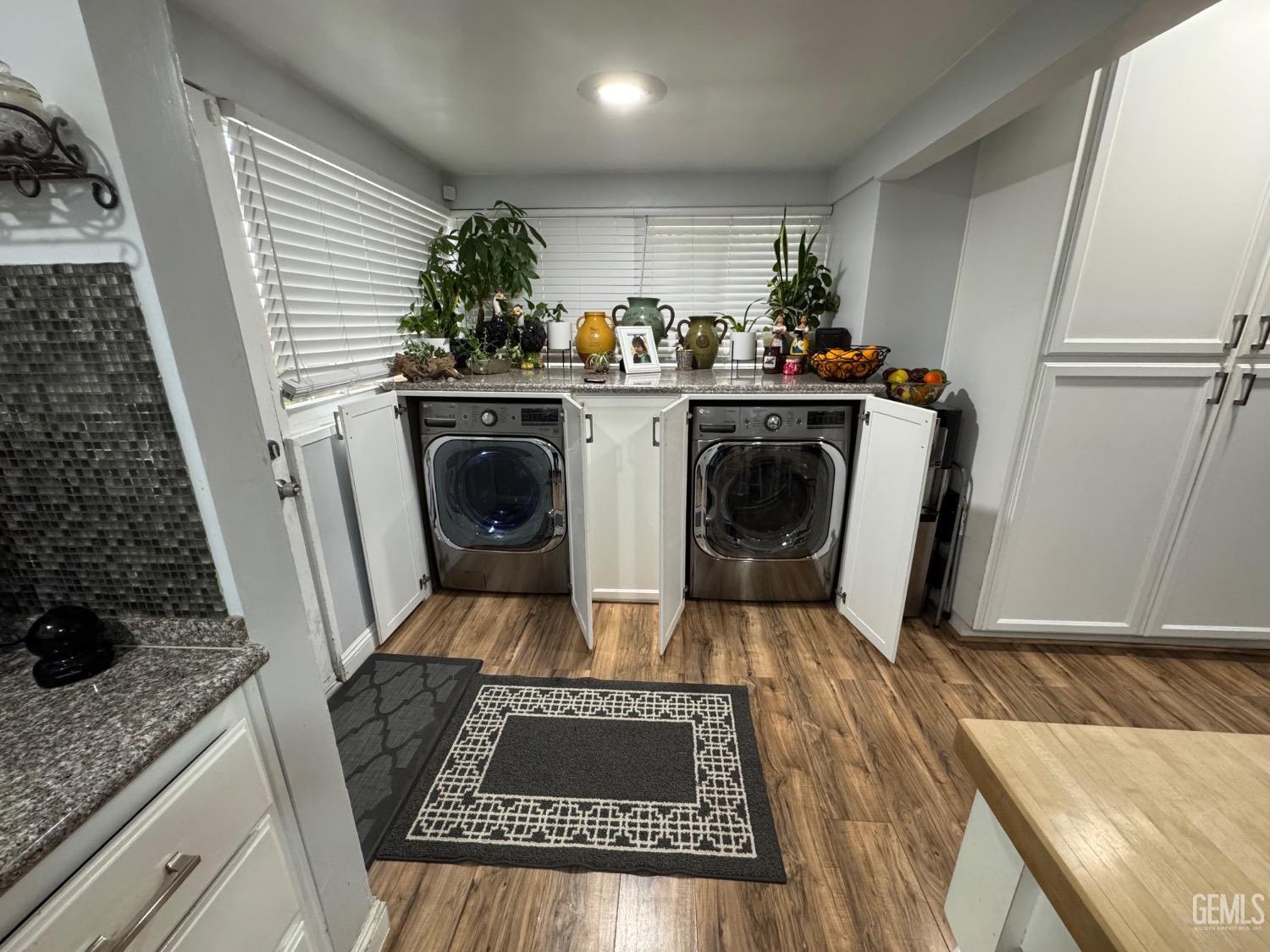 Undisclosed Address Bakersfield, CA 93304 - Photo 9 of 19 a utility room with sink washer and dryer