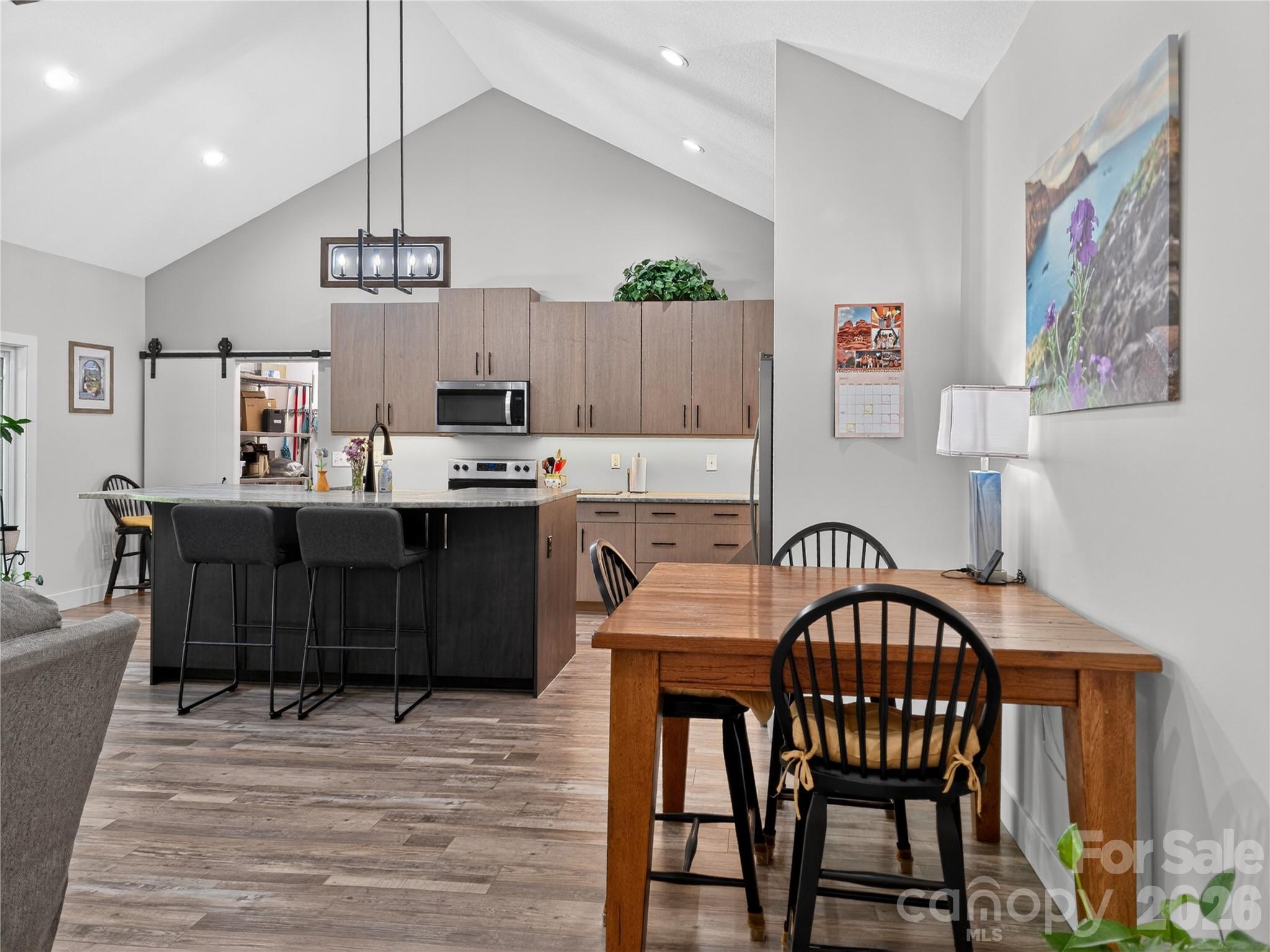 278 Hunters Trace Rutherfordton, NC 28139 - Photo 17 of 33 a kitchen with kitchen island a dining table and chairs