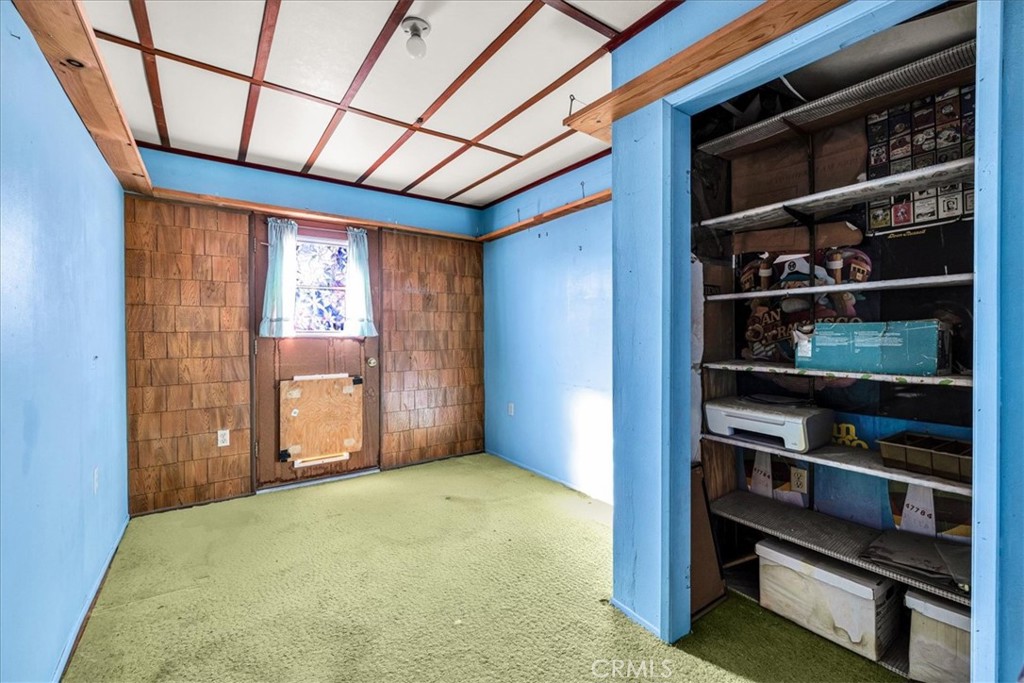 64720 Sonora Road Joshua Tree, CA 92252 - Photo 12 of 31 a view of an empty room with shelves