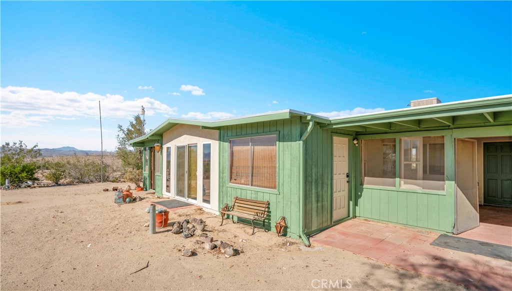 64720 Sonora Road Joshua Tree, CA 92252 - Photo 2 of 31 a view of a house with backyard and porch