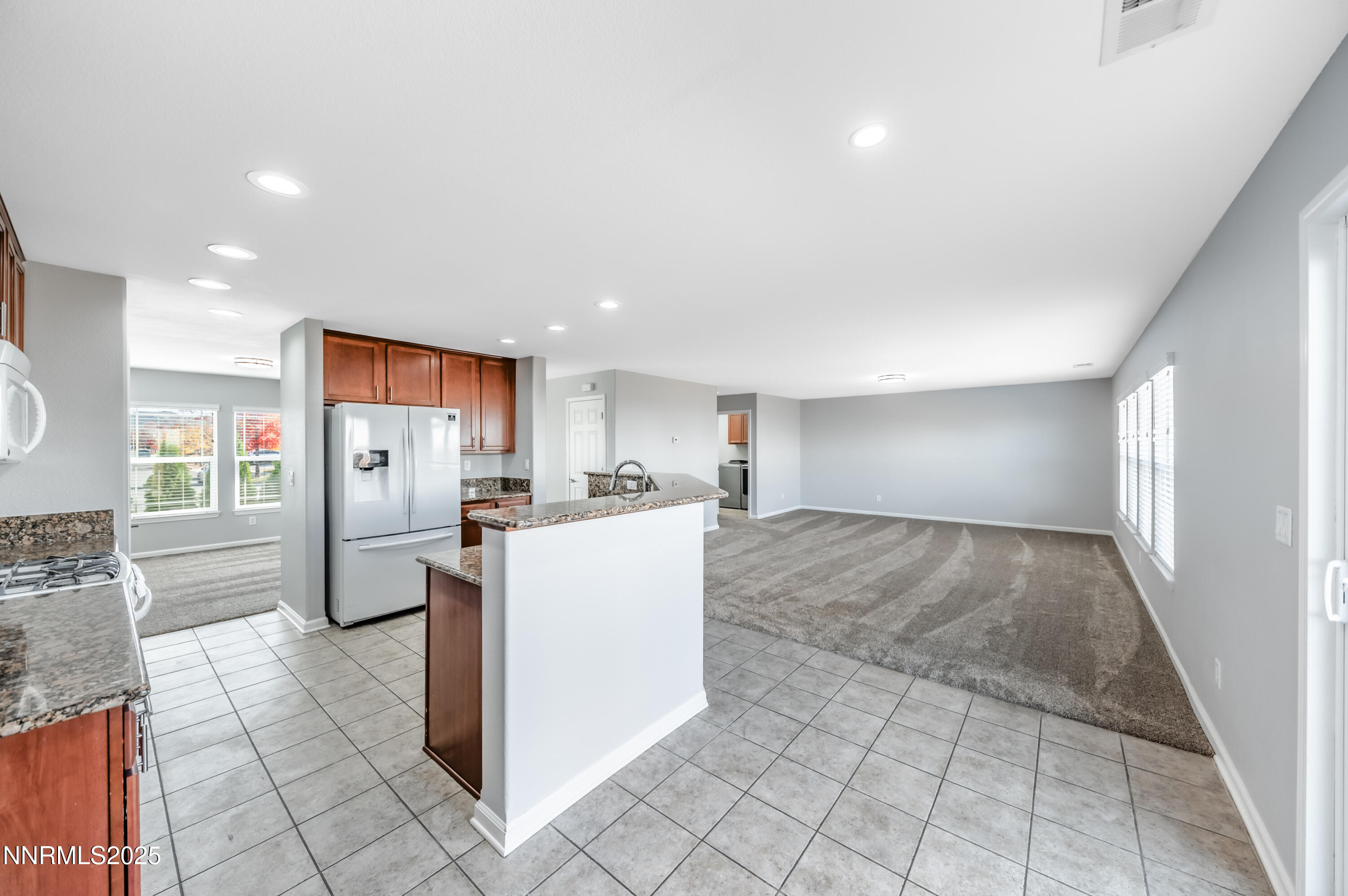 8905 Convair Way Reno, NV 89506 - Photo 15 of 38 a view of kitchen with refrigerator and cabinets