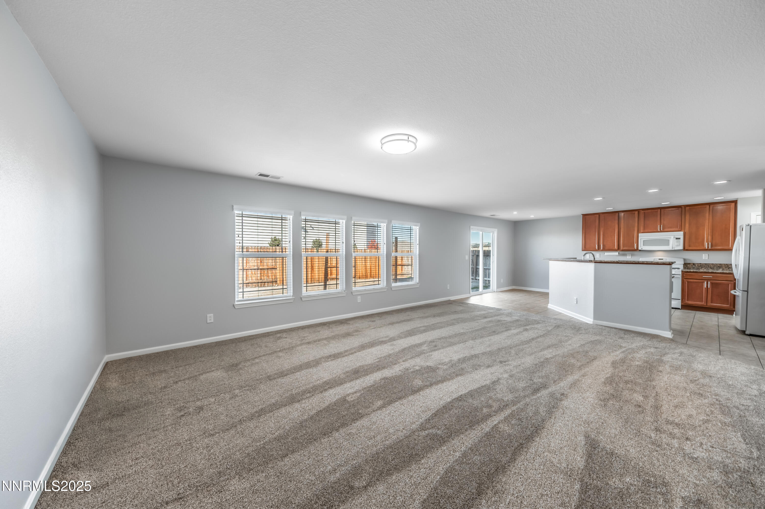 8905 Convair Way Reno, NV 89506 - Photo 18 of 38 a view of a room with kitchen appliances and windows