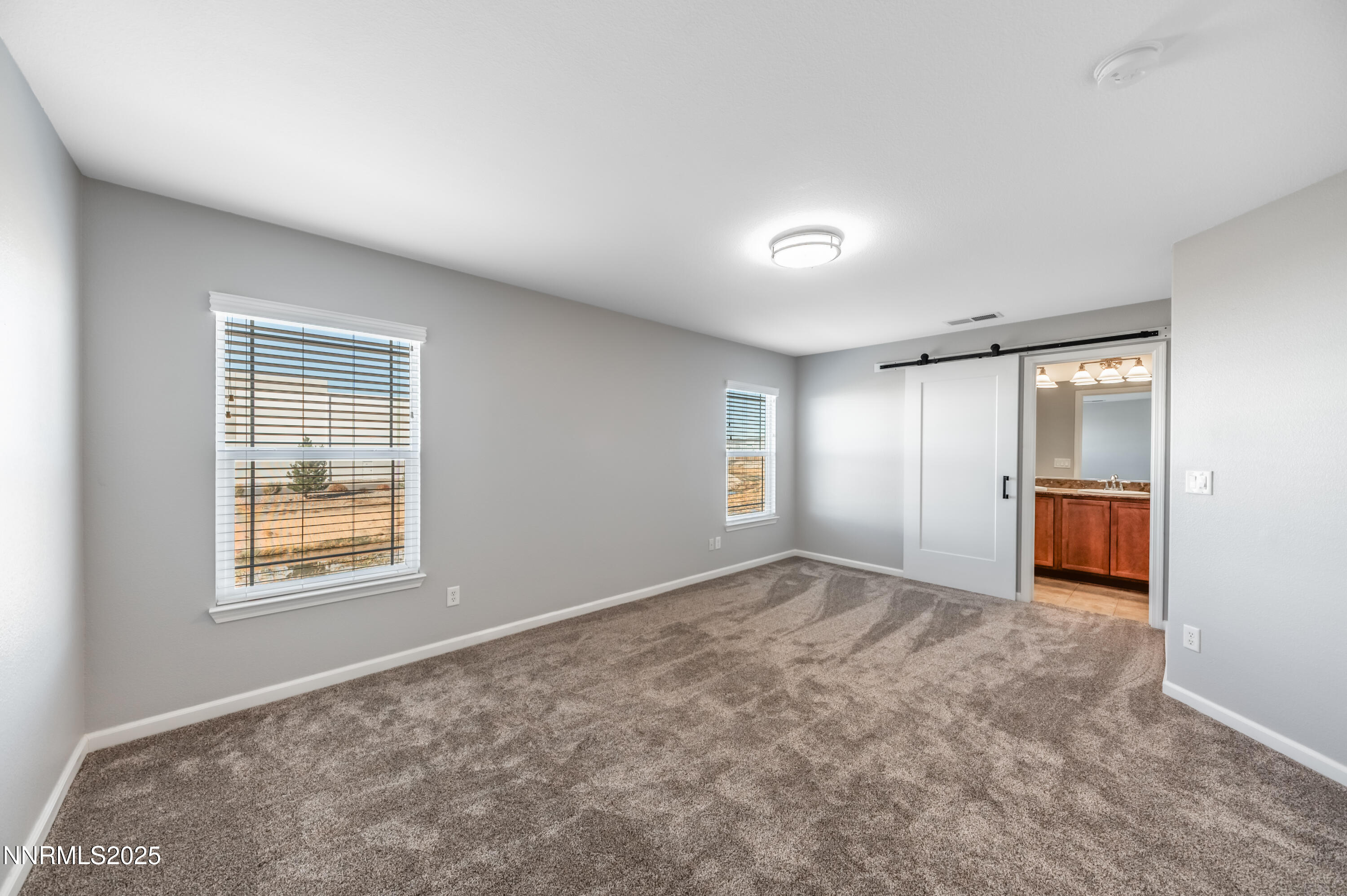 8905 Convair Way Reno, NV 89506 - Photo 24 of 38 wooden floor in an empty room with a window