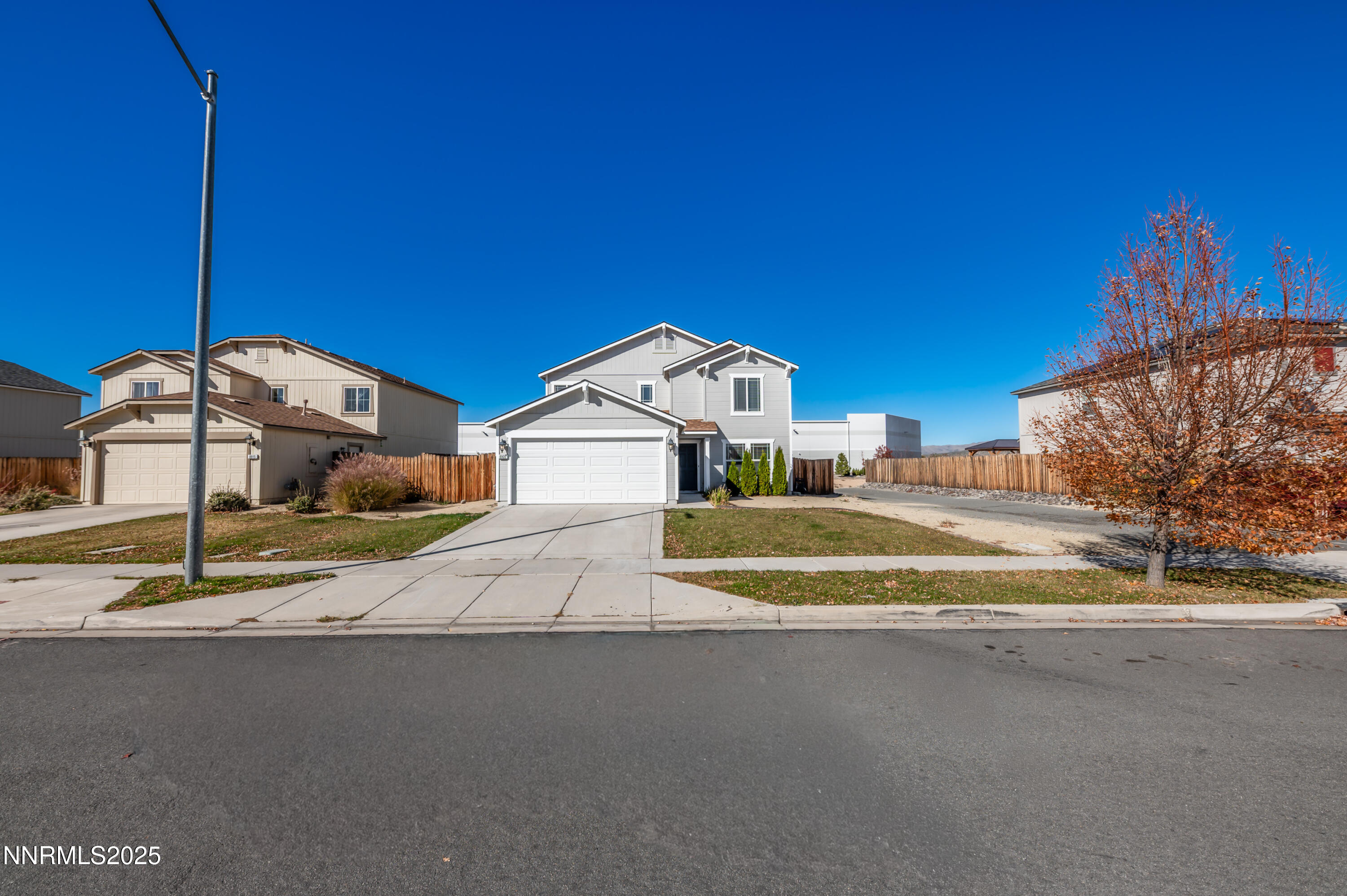 8905 Convair Way Reno, NV 89506 - Photo 3 of 38 a view of a street with houses