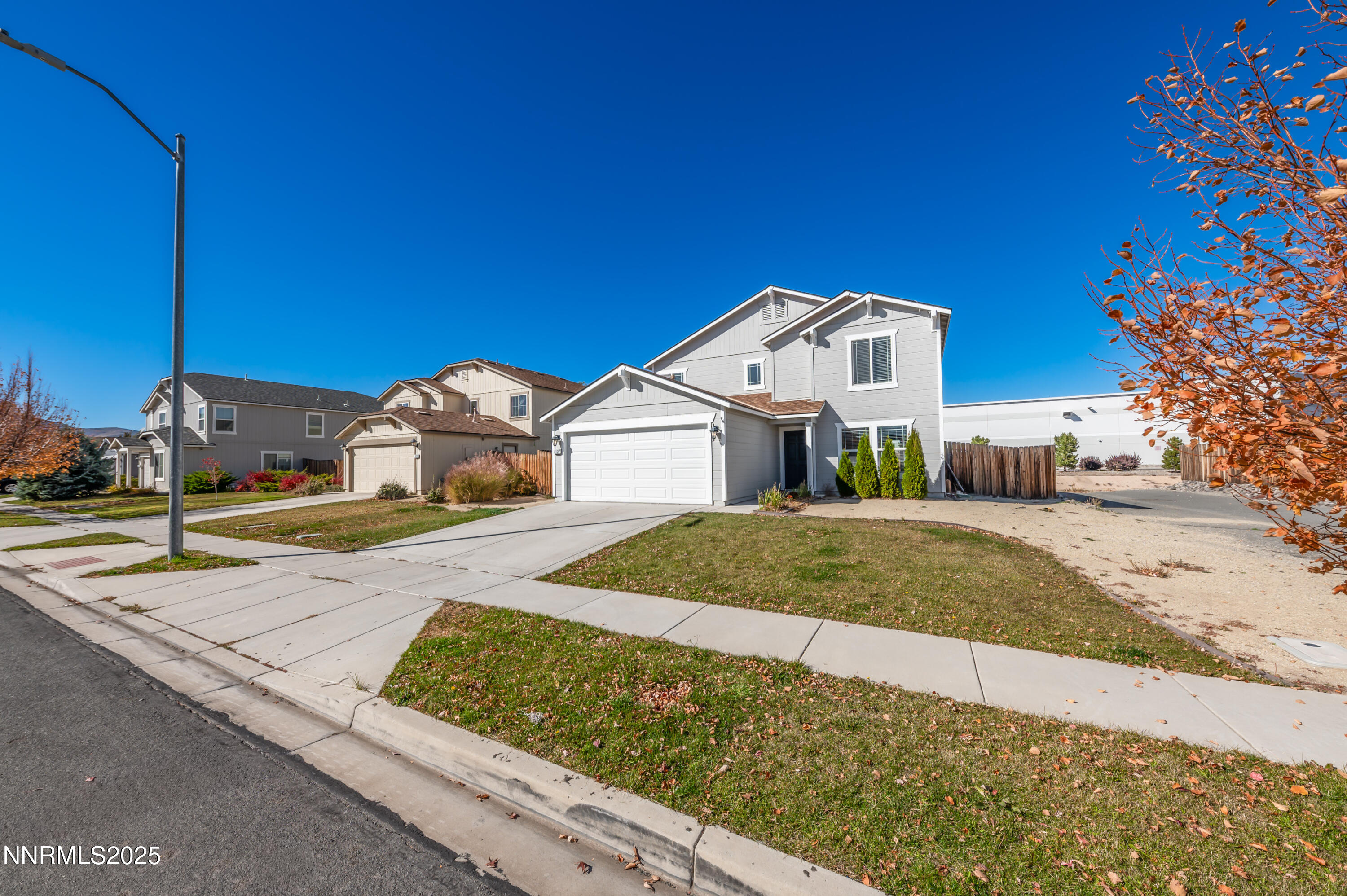 8905 Convair Way Reno, NV 89506 - Photo 4 of 38 a front view of a house with a yard