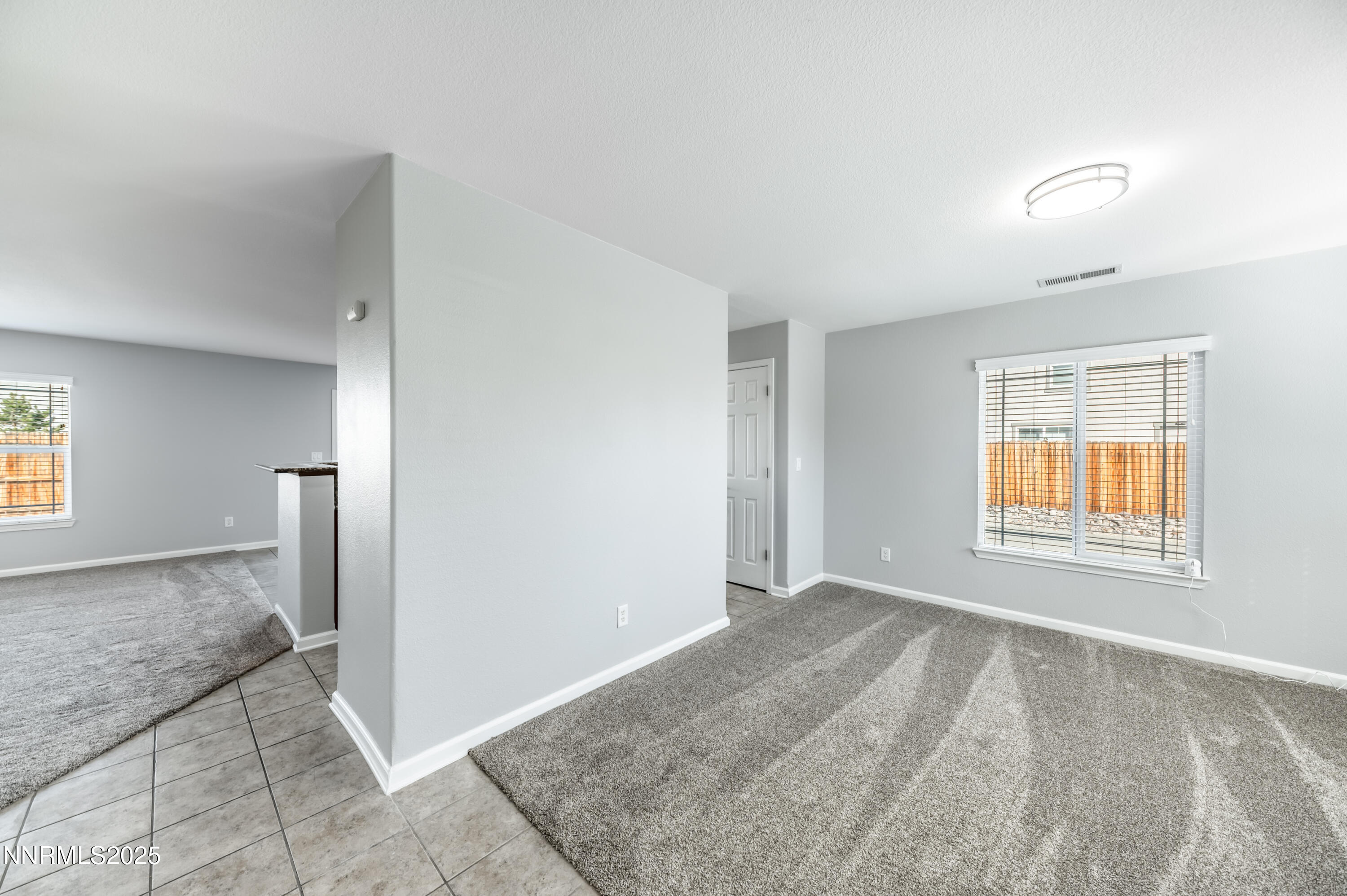 8905 Convair Way Reno, NV 89506 - Photo 7 of 38 an empty room with windows and closet