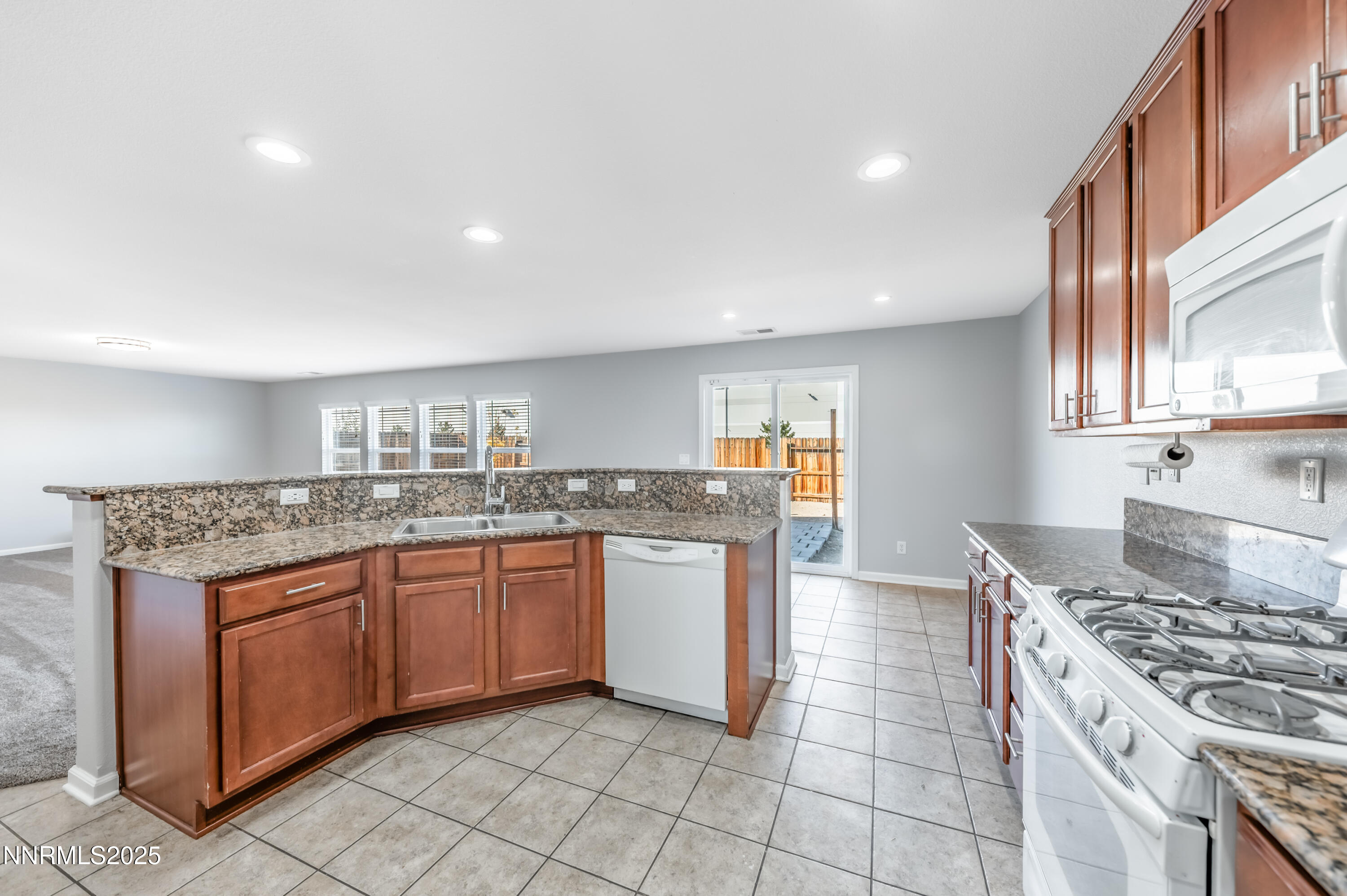 8905 Convair Way Reno, NV 89506 - Photo 10 of 38 a kitchen with a sink and cabinets