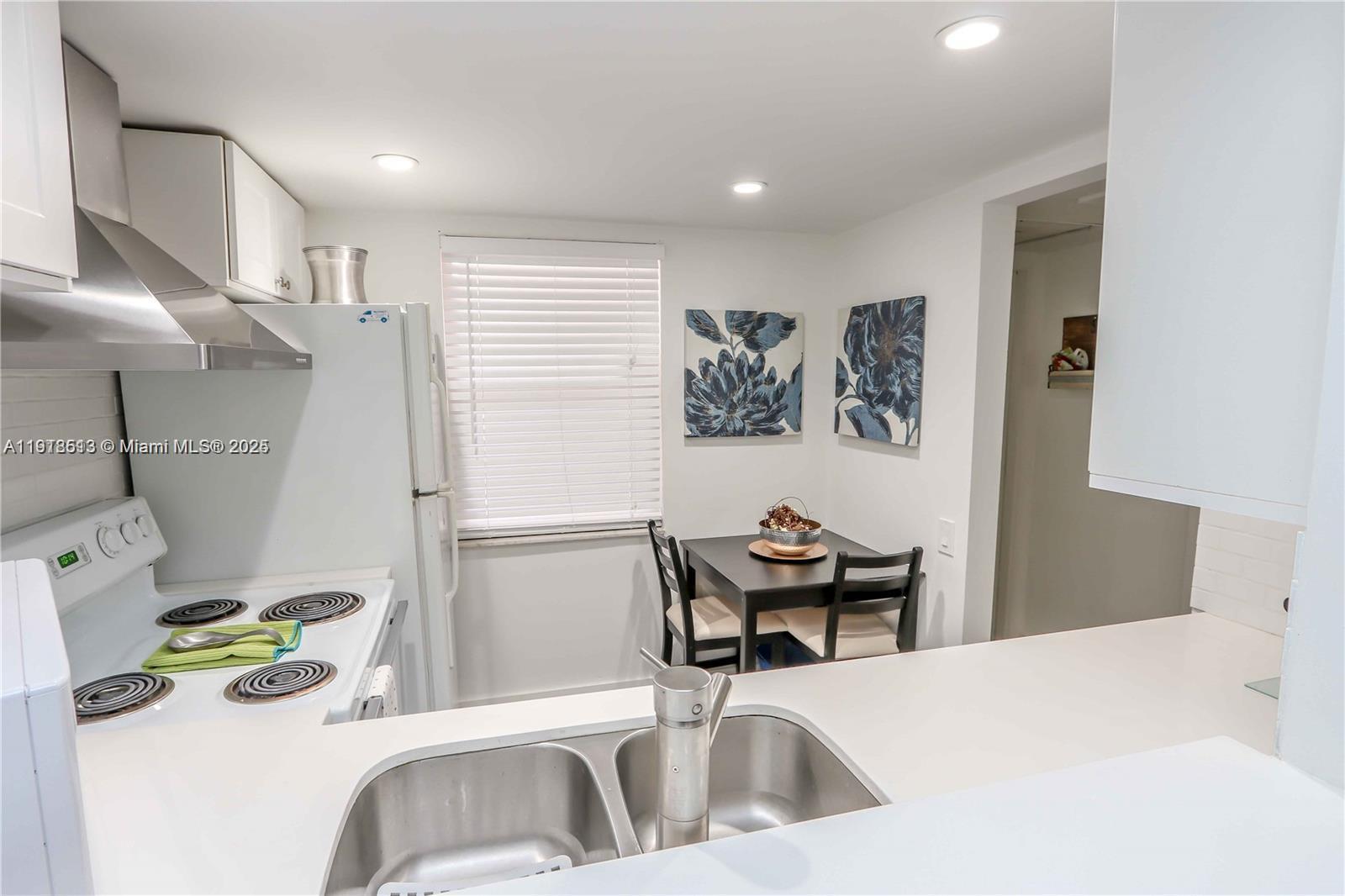 9150 Lime Bay Boulevard, Unit 212 Tamarac, FL 33321 - Photo 12 of 21 a bedroom with a bed and furniture