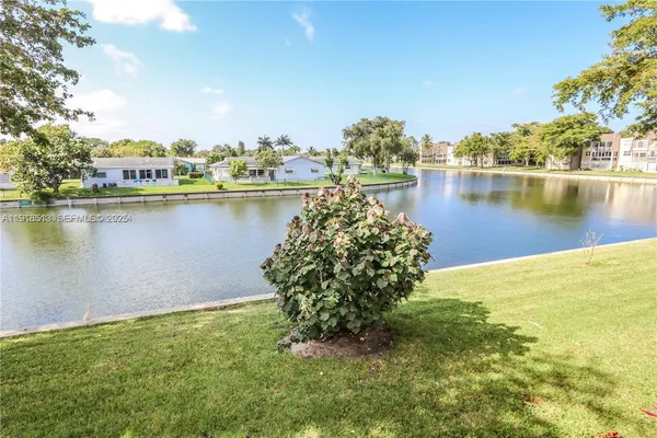 an aerial view of a houses with lake view