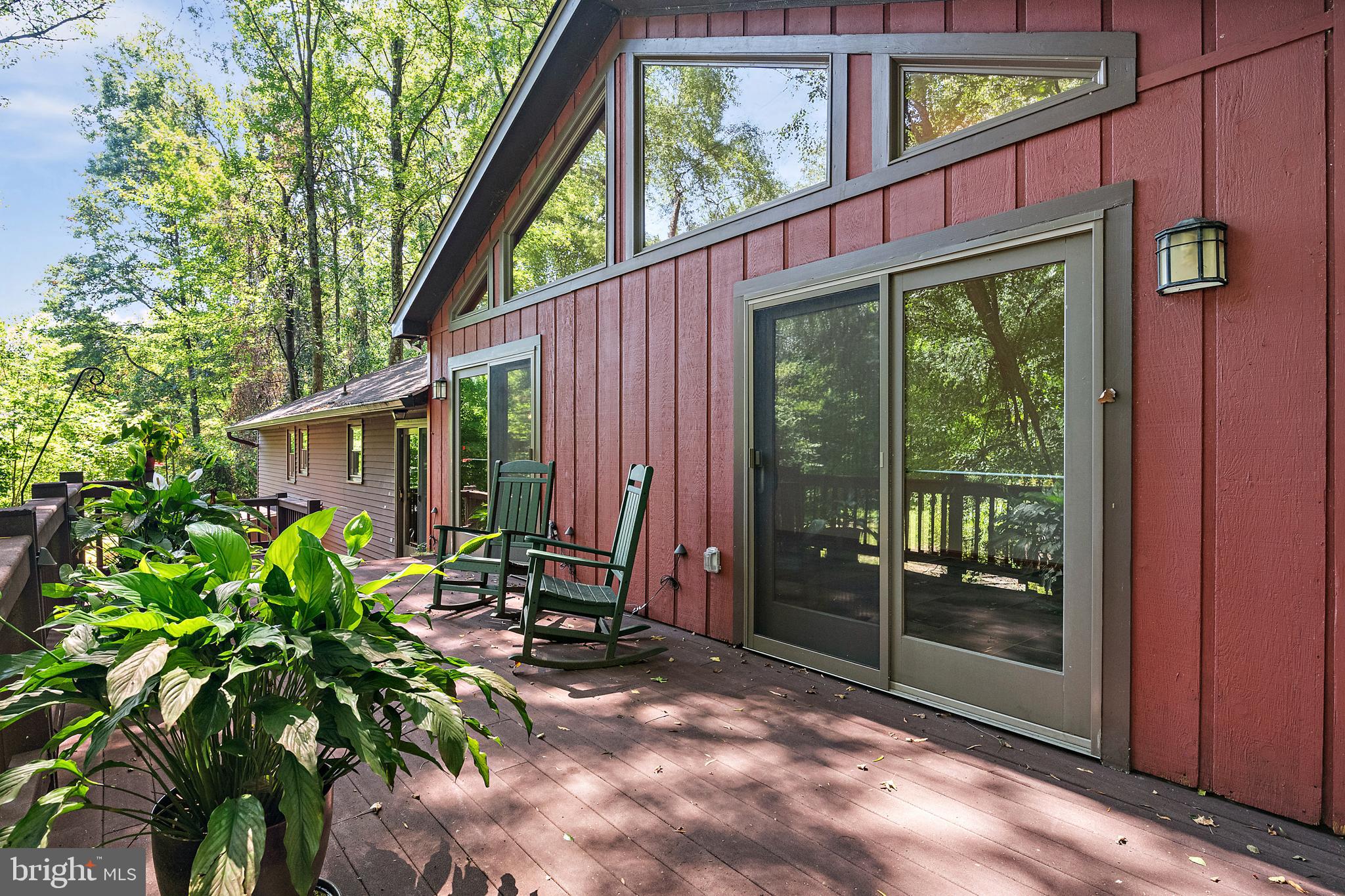 1701 Underwood Road Gambrills, MD 21054 - Photo 14 of 62 a view of backyard with a large tree and wooden fence