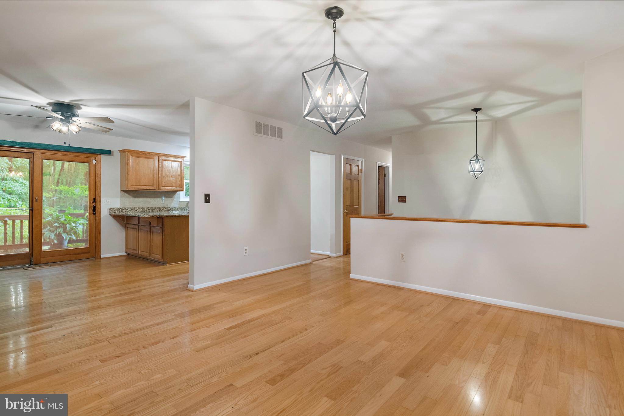 1701 Underwood Road Gambrills, MD 21054 - Photo 19 of 62 a view of a kitchen with wooden floor and a ceiling fan