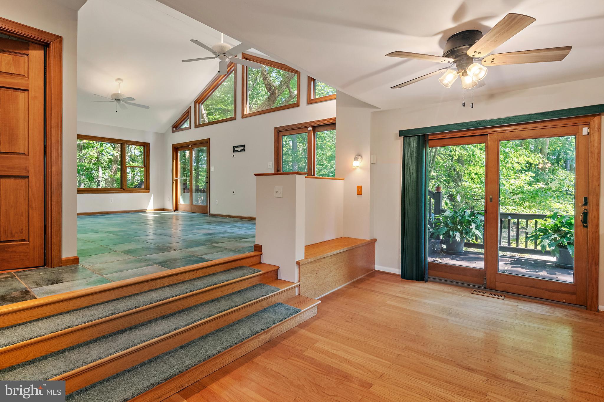 1701 Underwood Road Gambrills, MD 21054 - Photo 22 of 62 a living room with hardwood floor and a large window with outer view