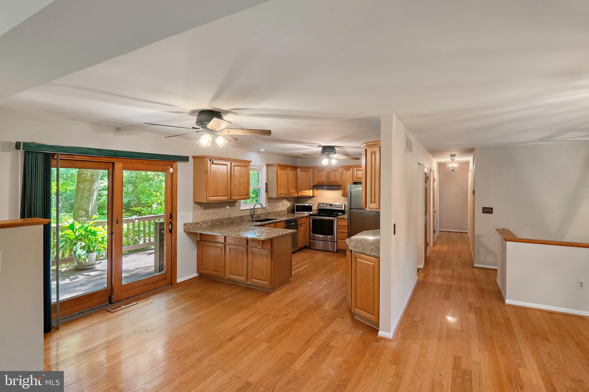 1701 Underwood Road Gambrills, MD 21054 - Photo 28 of 62 a view of a living room and kitchen with furniture wooden floor