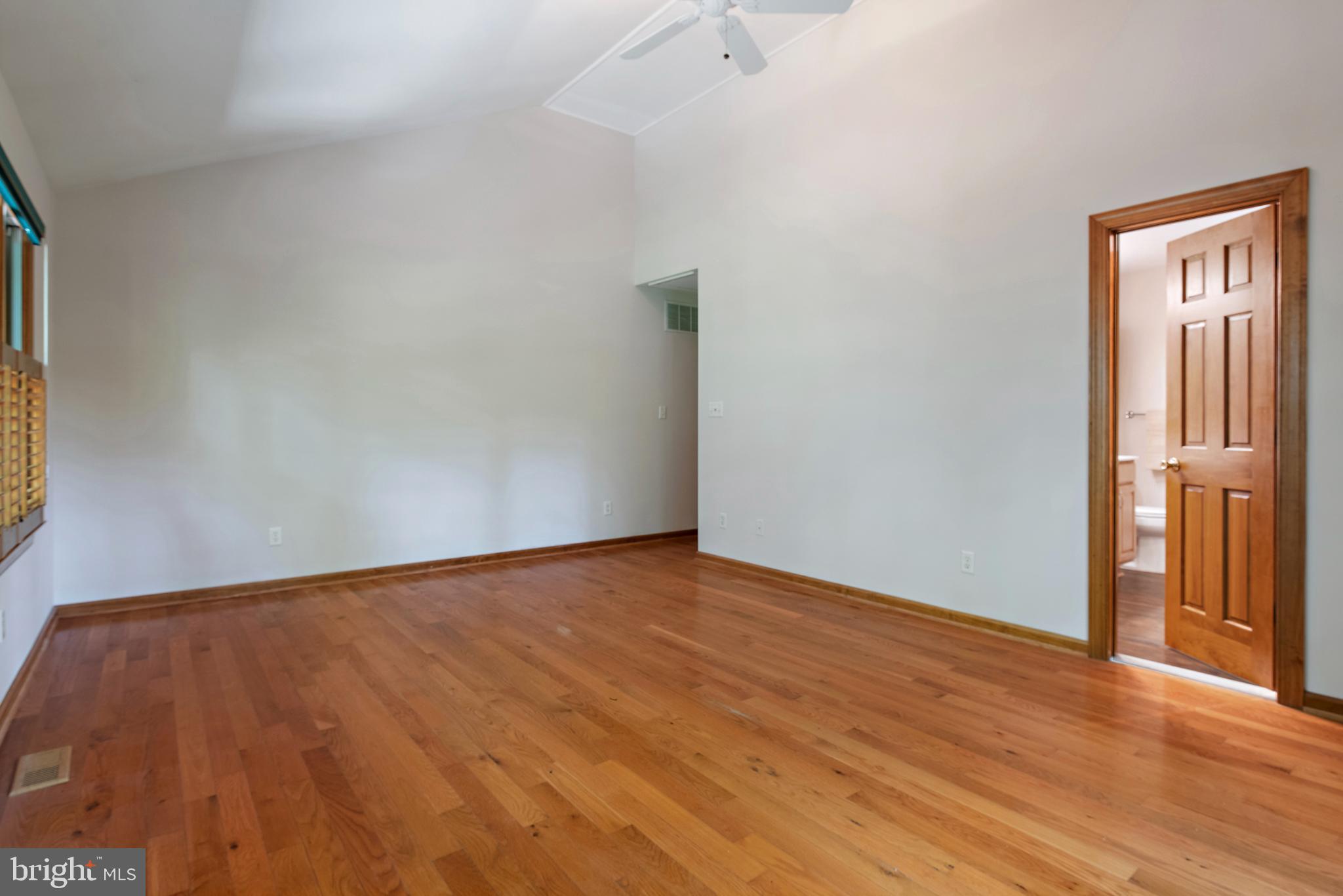 1701 Underwood Road Gambrills, MD 21054 - Photo 35 of 62 a view of an empty room with wooden floor and a window
