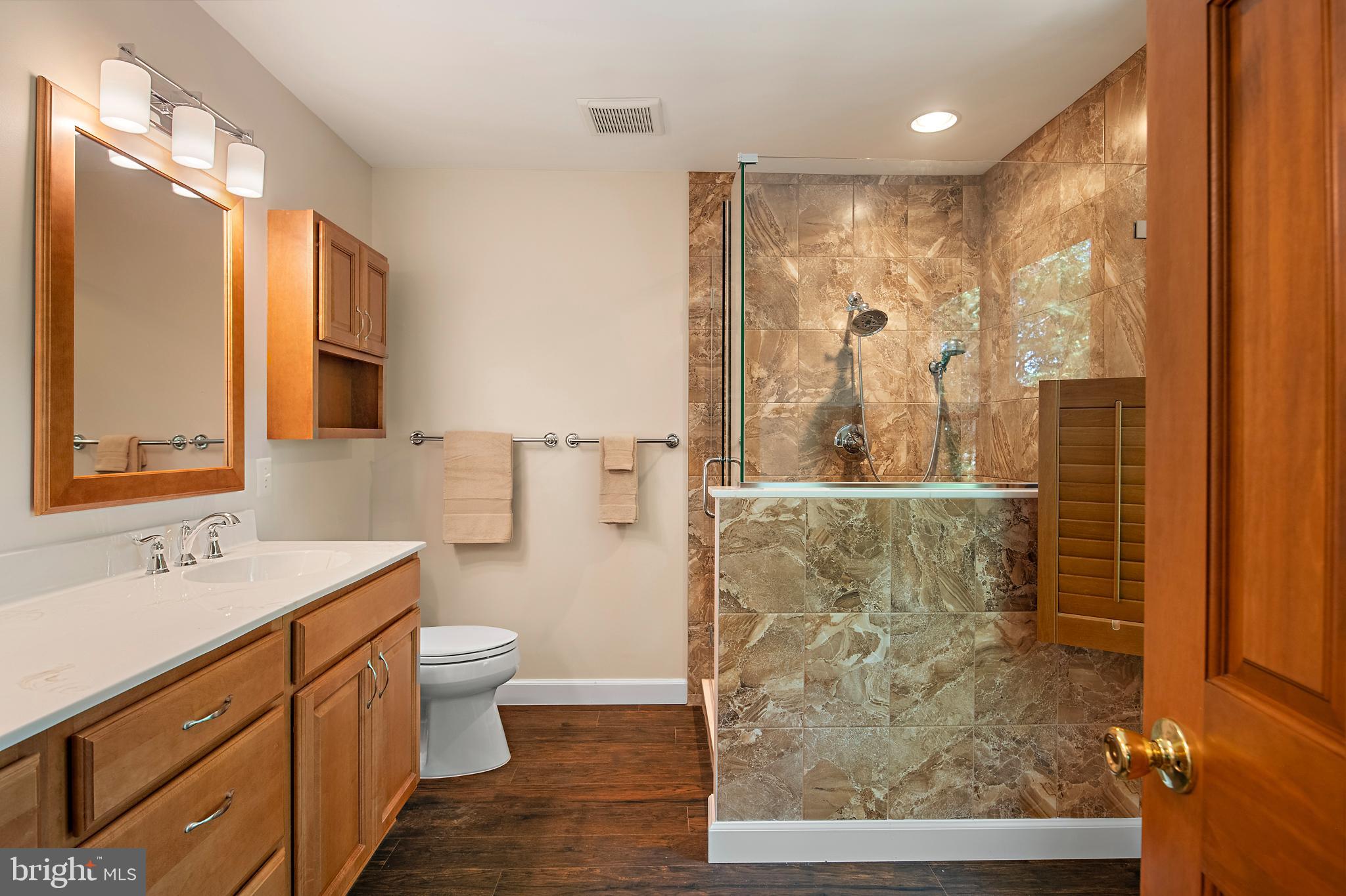 1701 Underwood Road Gambrills, MD 21054 - Photo 37 of 62 a bathroom with a double vanity sink mirror and toilet