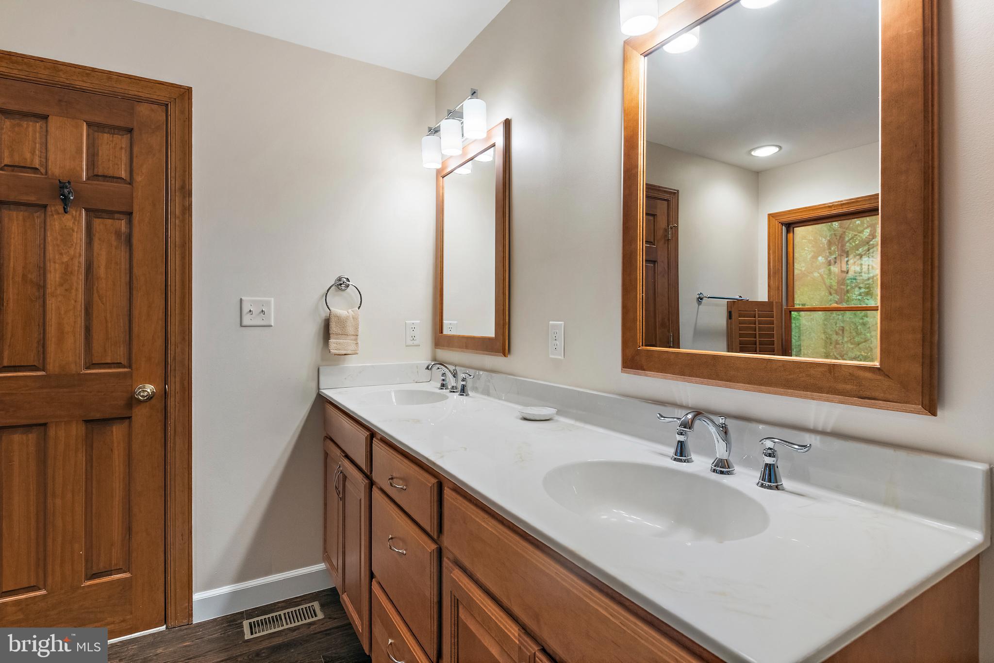 1701 Underwood Road Gambrills, MD 21054 - Photo 38 of 62 a bathroom with 2 sink and a mirror
