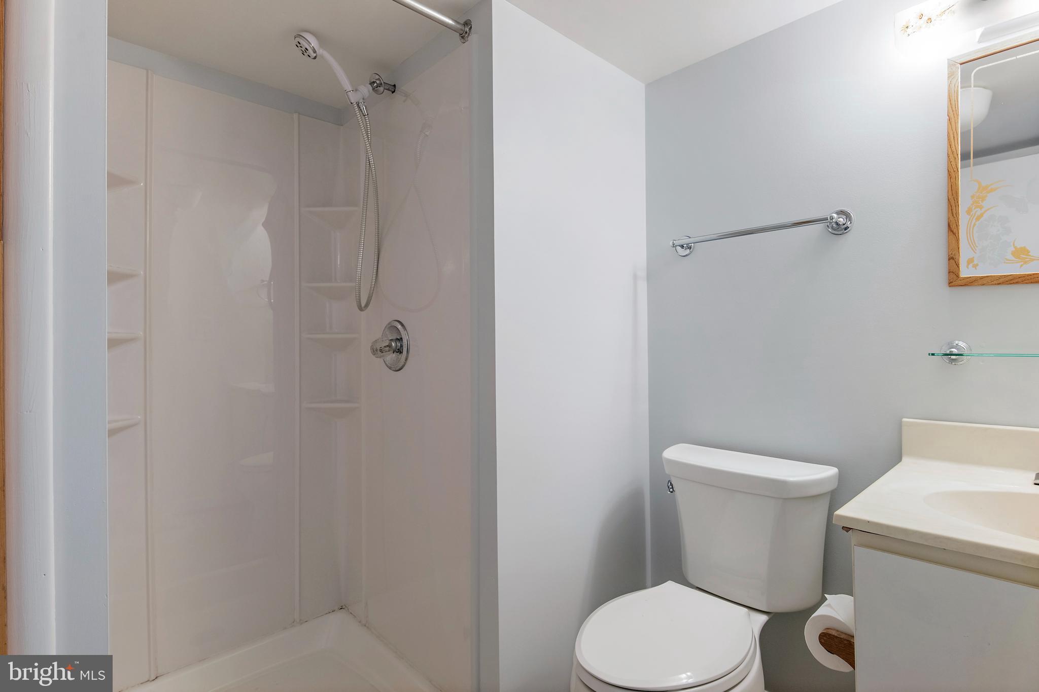 1701 Underwood Road Gambrills, MD 21054 - Photo 57 of 62 a white toilet sitting next to a bathroom sink