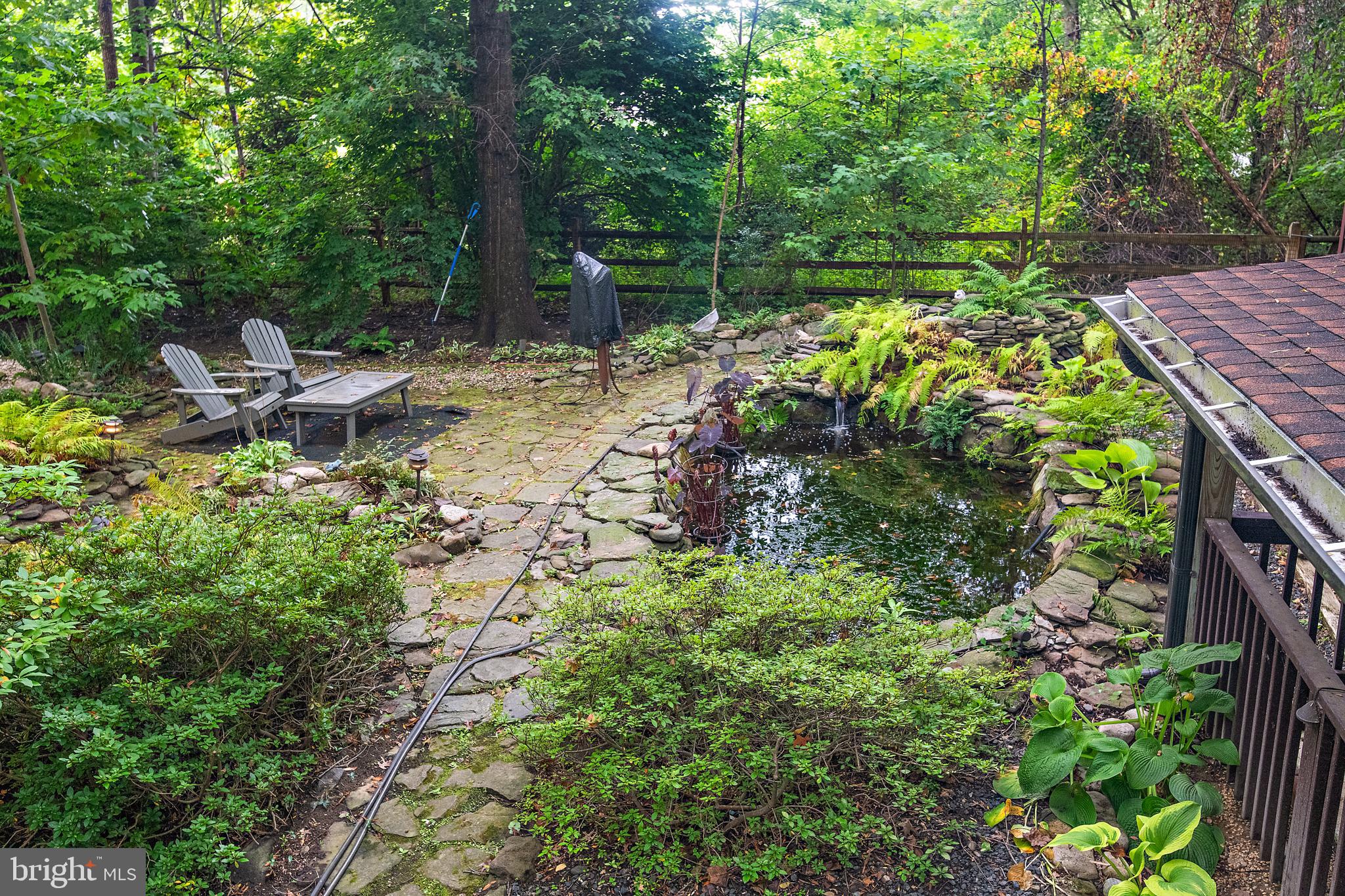 1701 Underwood Road Gambrills, MD 21054 - Photo 58 of 62 a backyard of a house with lots of green space and fountain