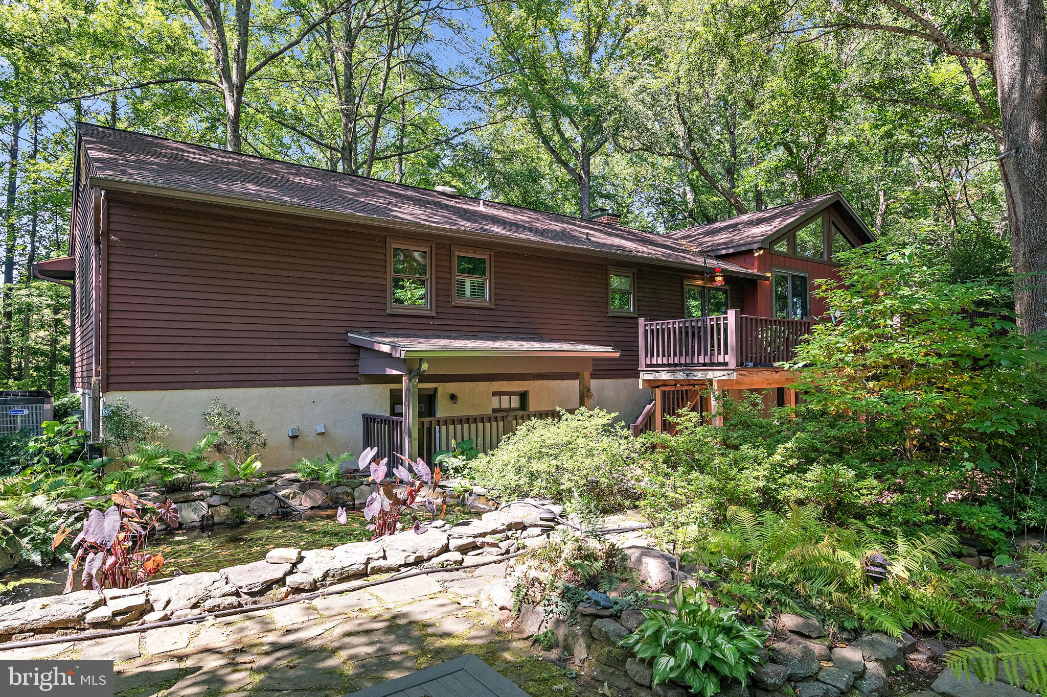 1701 Underwood Road Gambrills, MD 21054 - Photo 6 of 62 a front view of a house with a yard