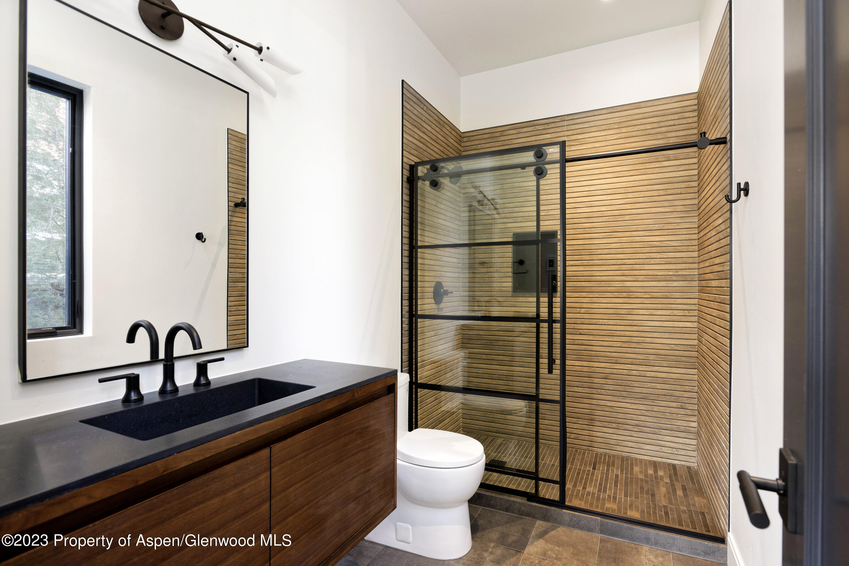 415 Meadow Court Basalt, CO 81621 - Photo 14 of 19 a bathroom with a sink a toilet and shower