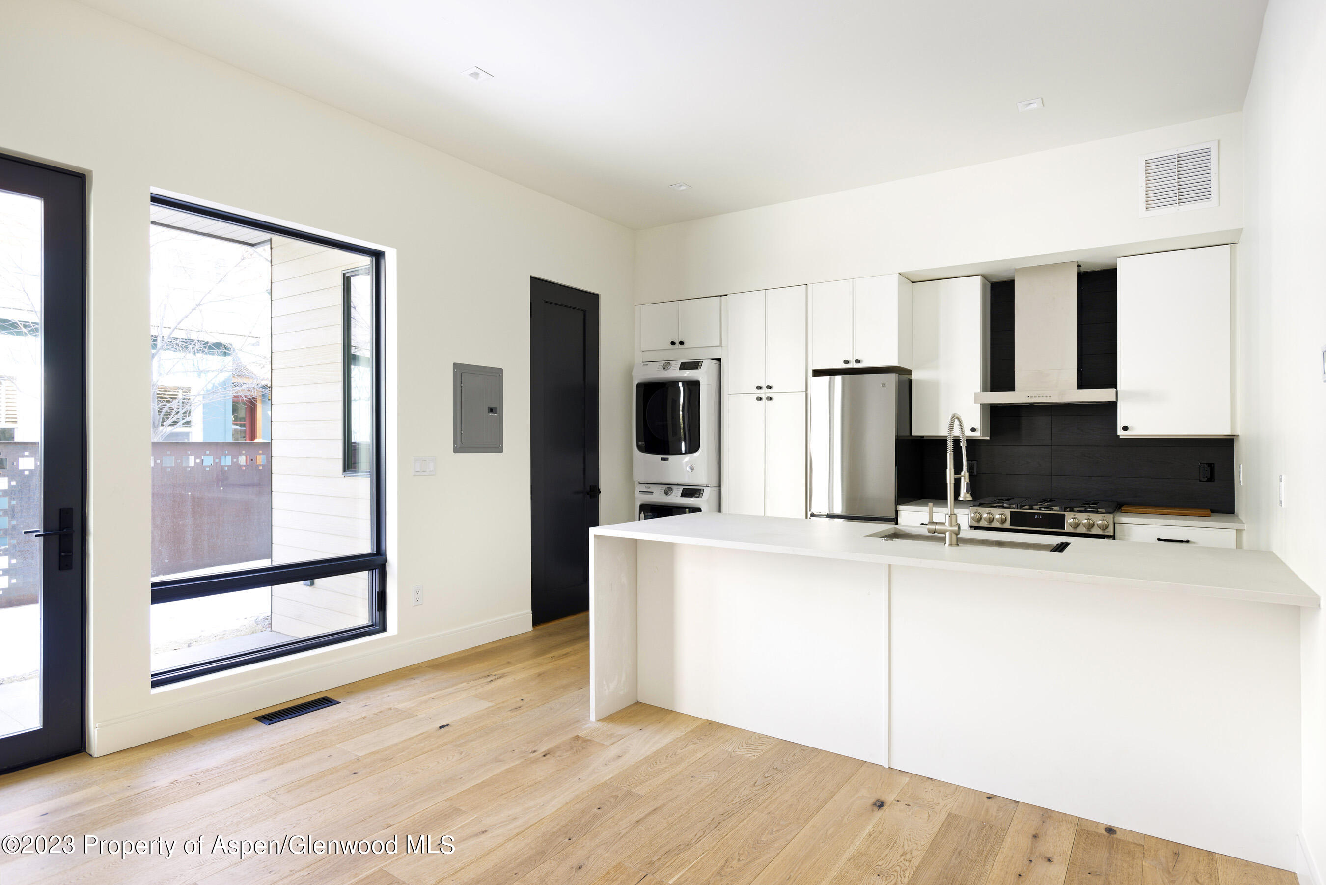 415 Meadow Court Basalt, CO 81621 - Photo 17 of 19 a large kitchen with kitchen island a sink stainless steel appliances and cabinets
