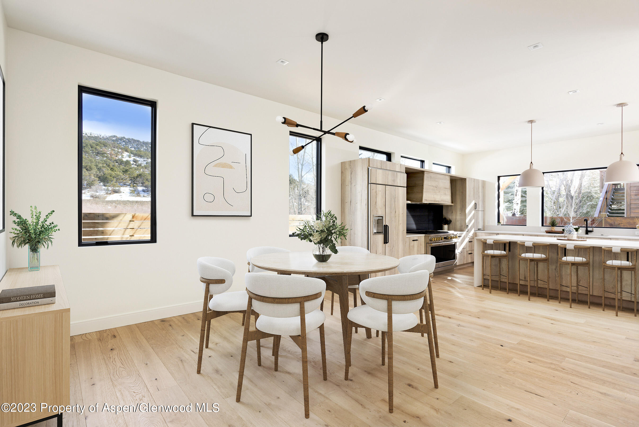 415 Meadow Court Basalt, CO 81621 - Photo 3 of 19 a view of a dining room with furniture window and wooden floor