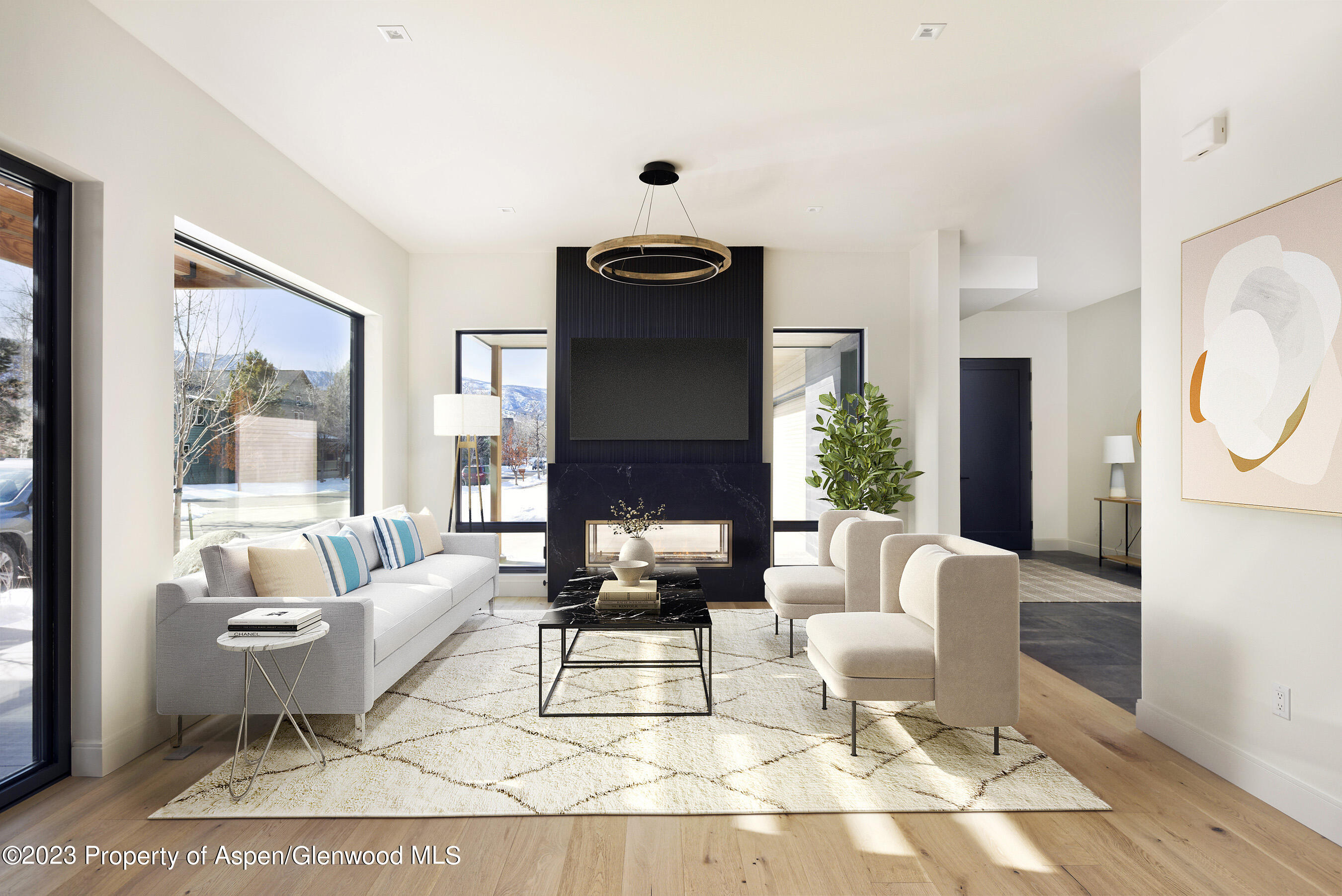 415 Meadow Court Basalt, CO 81621 - Photo 7 of 19 a living room with furniture a rug potted plant and a window