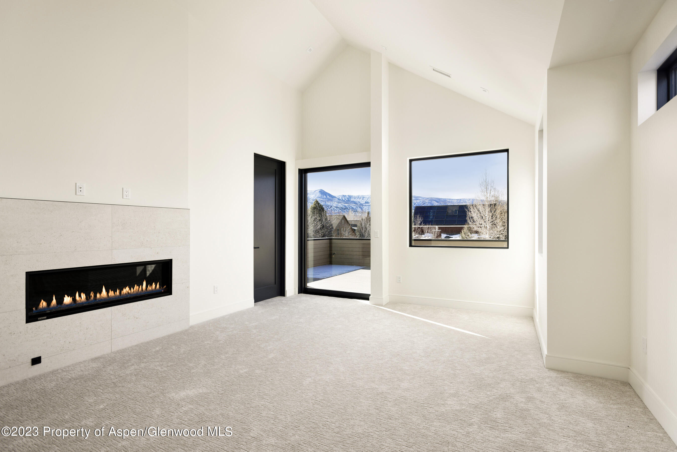 415 Meadow Court Basalt, CO 81621 - Photo 8 of 19 a view of an empty room with a fireplace
