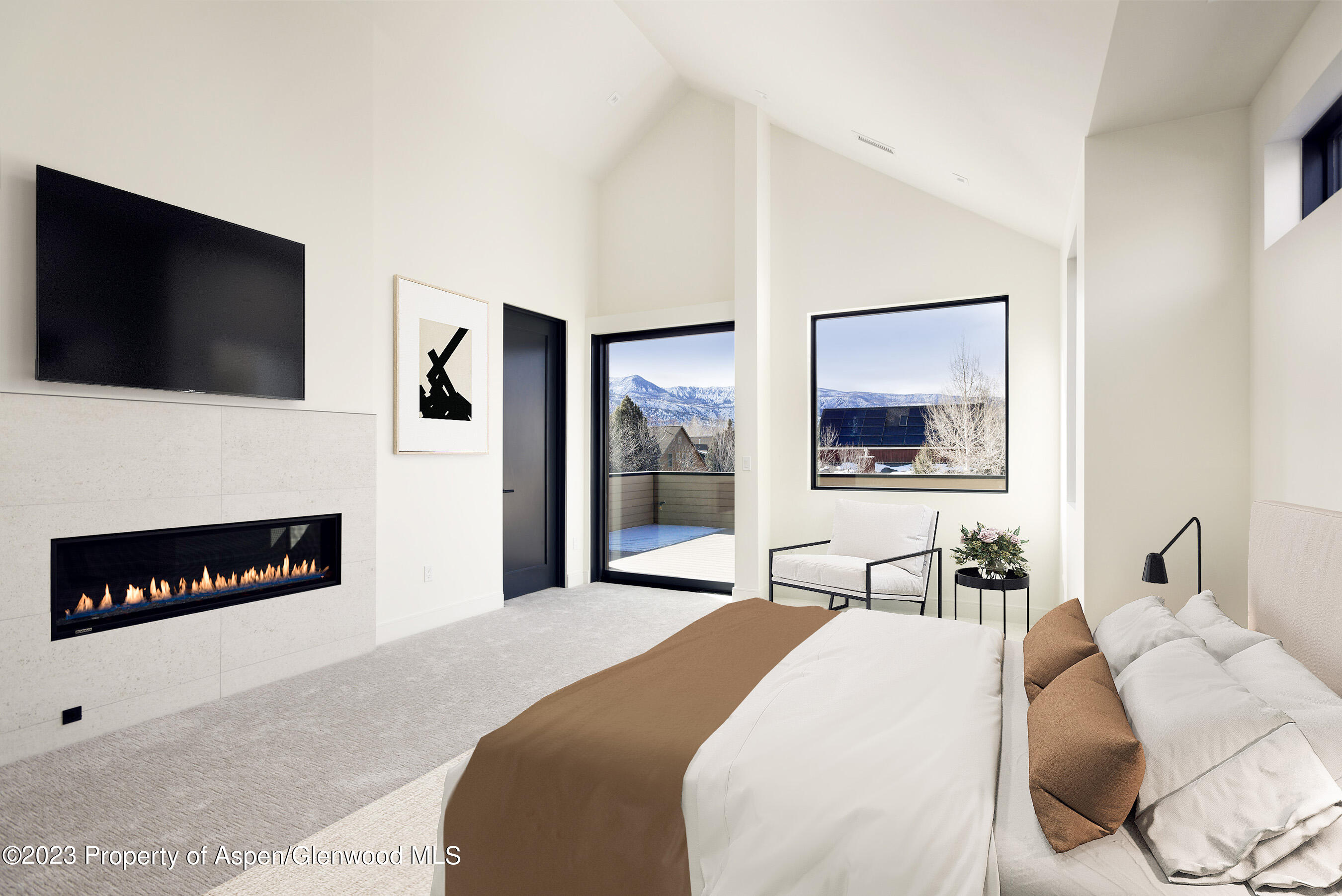 415 Meadow Court Basalt, CO 81621 - Photo 9 of 19 a bedroom with a bed and a flat screen tv