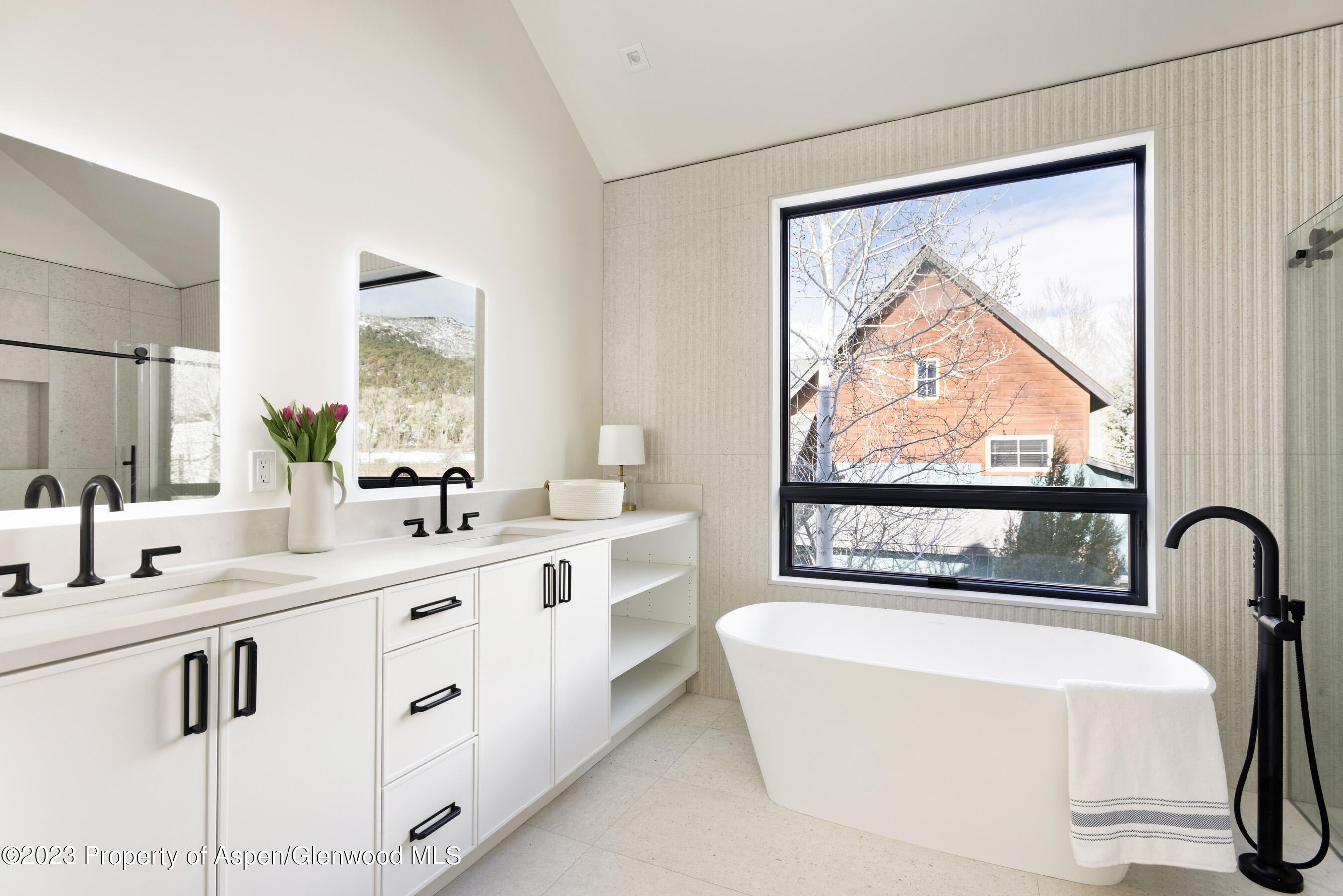 415 Meadow Court Basalt, CO 81621 - Photo 10 of 19 a bathroom with a bathtub and a sink