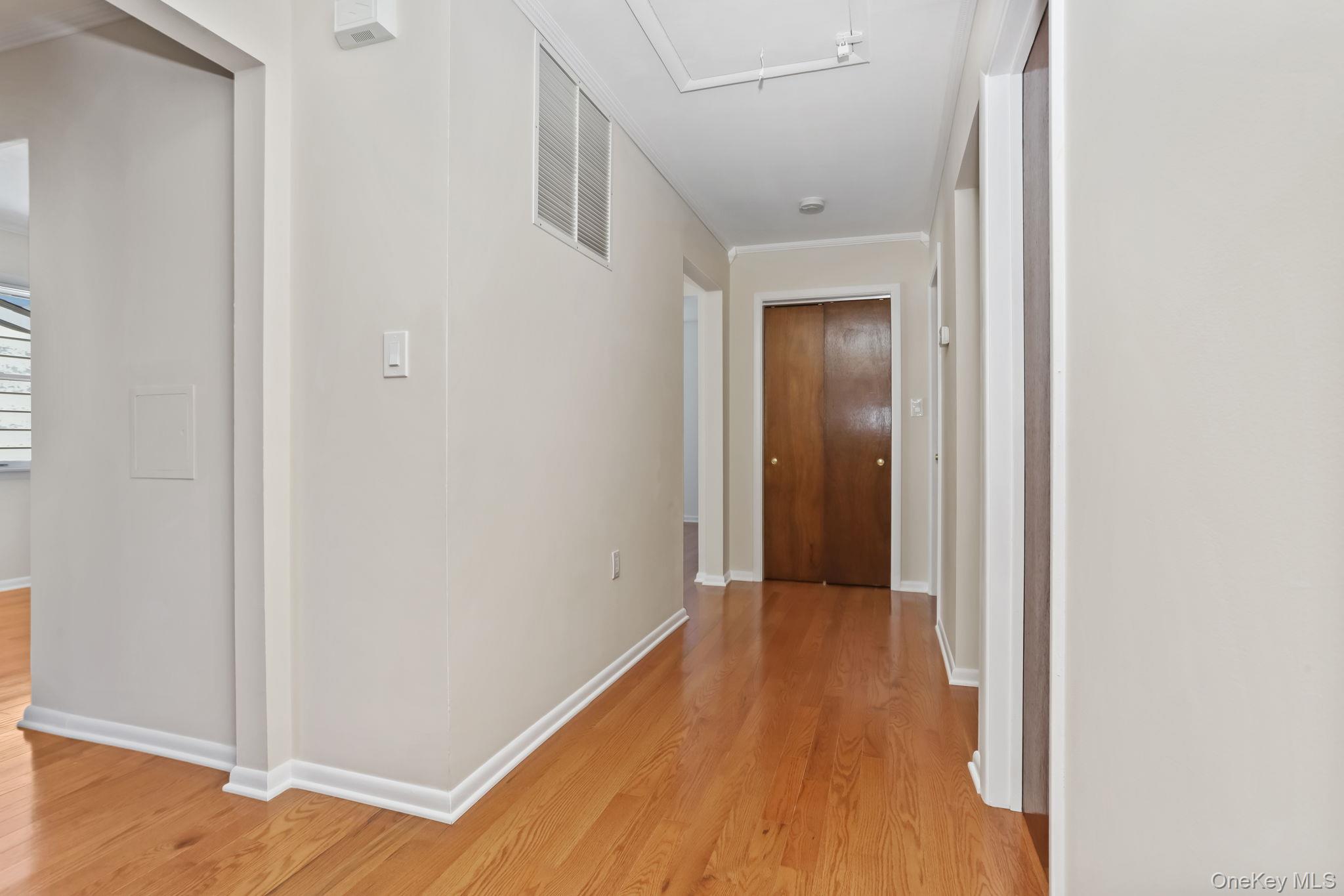 160 Lakeview Avenue, Unit 2 West Harrison, NY 10604 - Photo 3 of 19 a view of a hallway with wooden floor